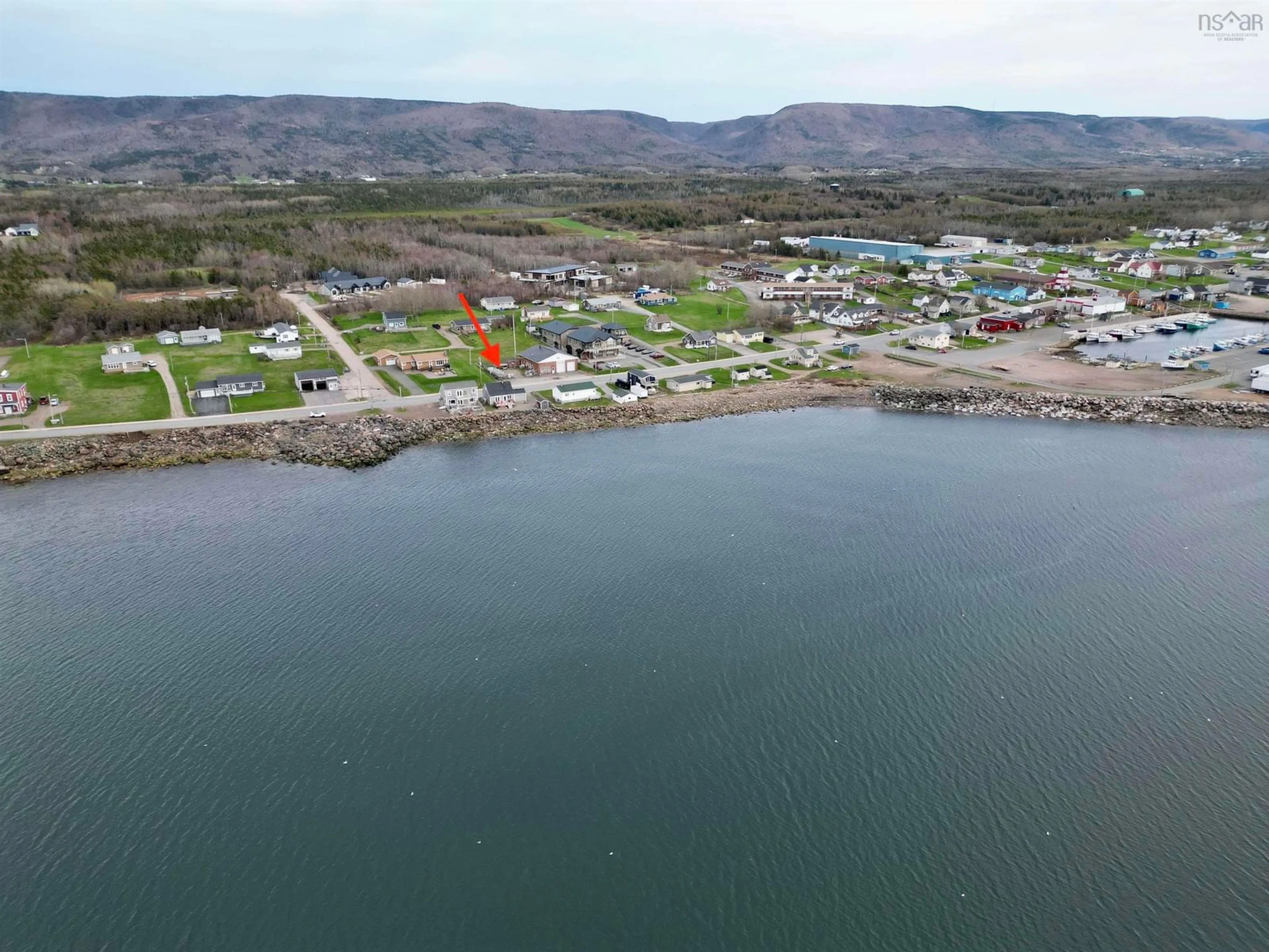 A pic from outside/outdoor area/front of a property/back of a property/a pic from drone, water/lake/river/ocean view for 15491 Cabot Trail Rd, Chéticamp Nova Scotia B0E 1H0