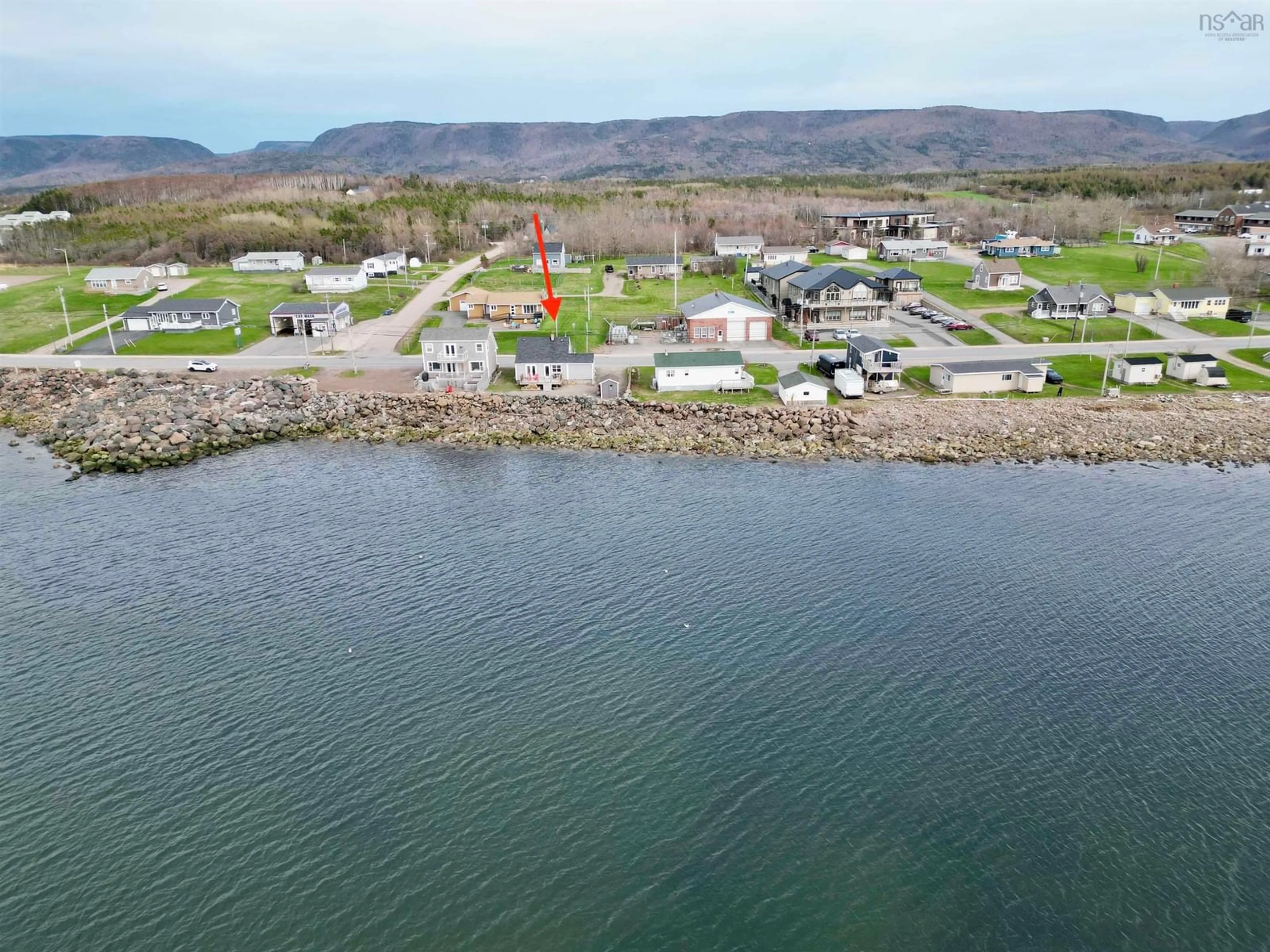 A pic from outside/outdoor area/front of a property/back of a property/a pic from drone, water/lake/river/ocean view for 15491 Cabot Trail Rd, Chéticamp Nova Scotia B0E 1H0