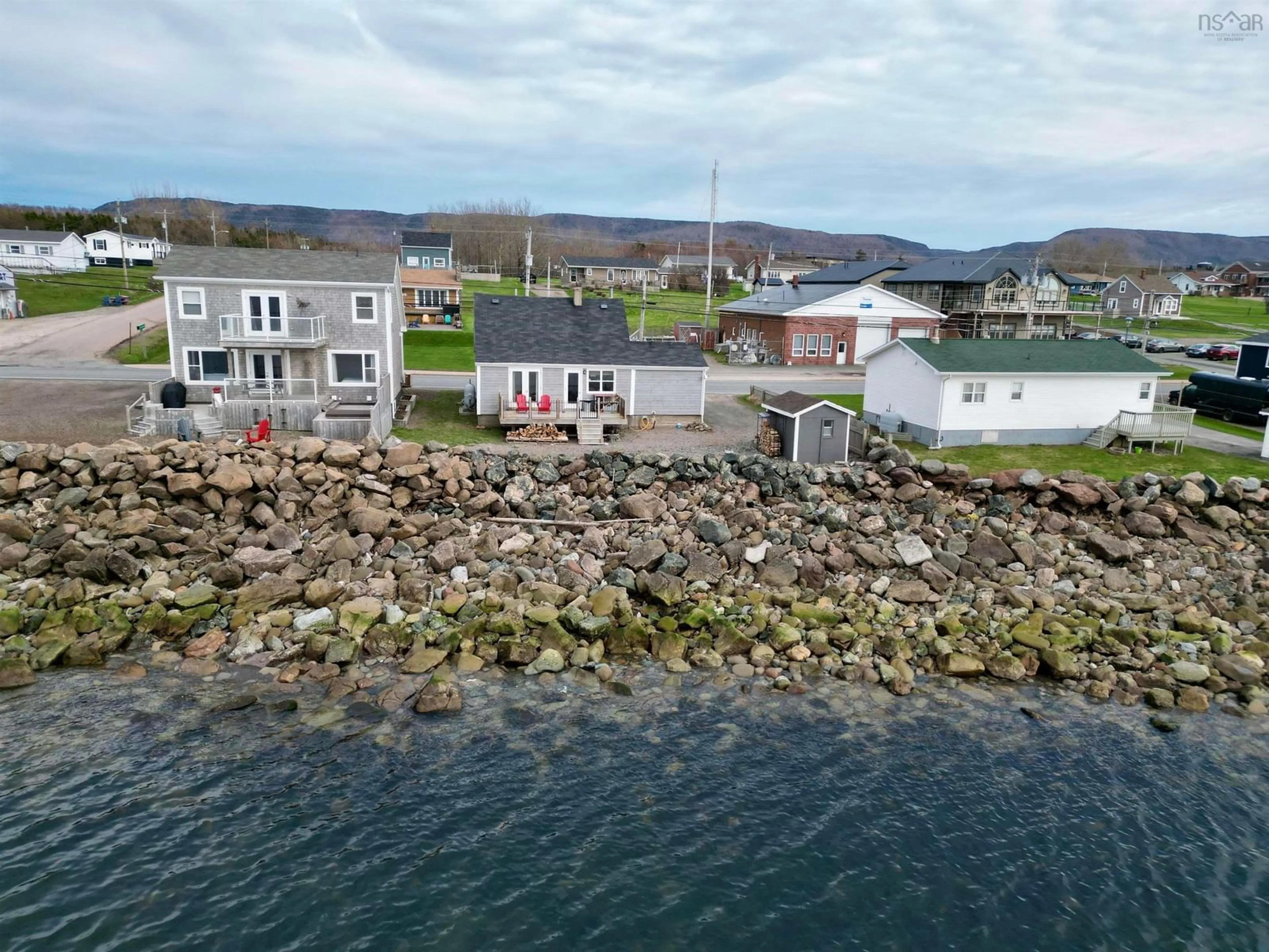 A pic from outside/outdoor area/front of a property/back of a property/a pic from drone, water/lake/river/ocean view for 15491 Cabot Trail Rd, Chéticamp Nova Scotia B0E 1H0