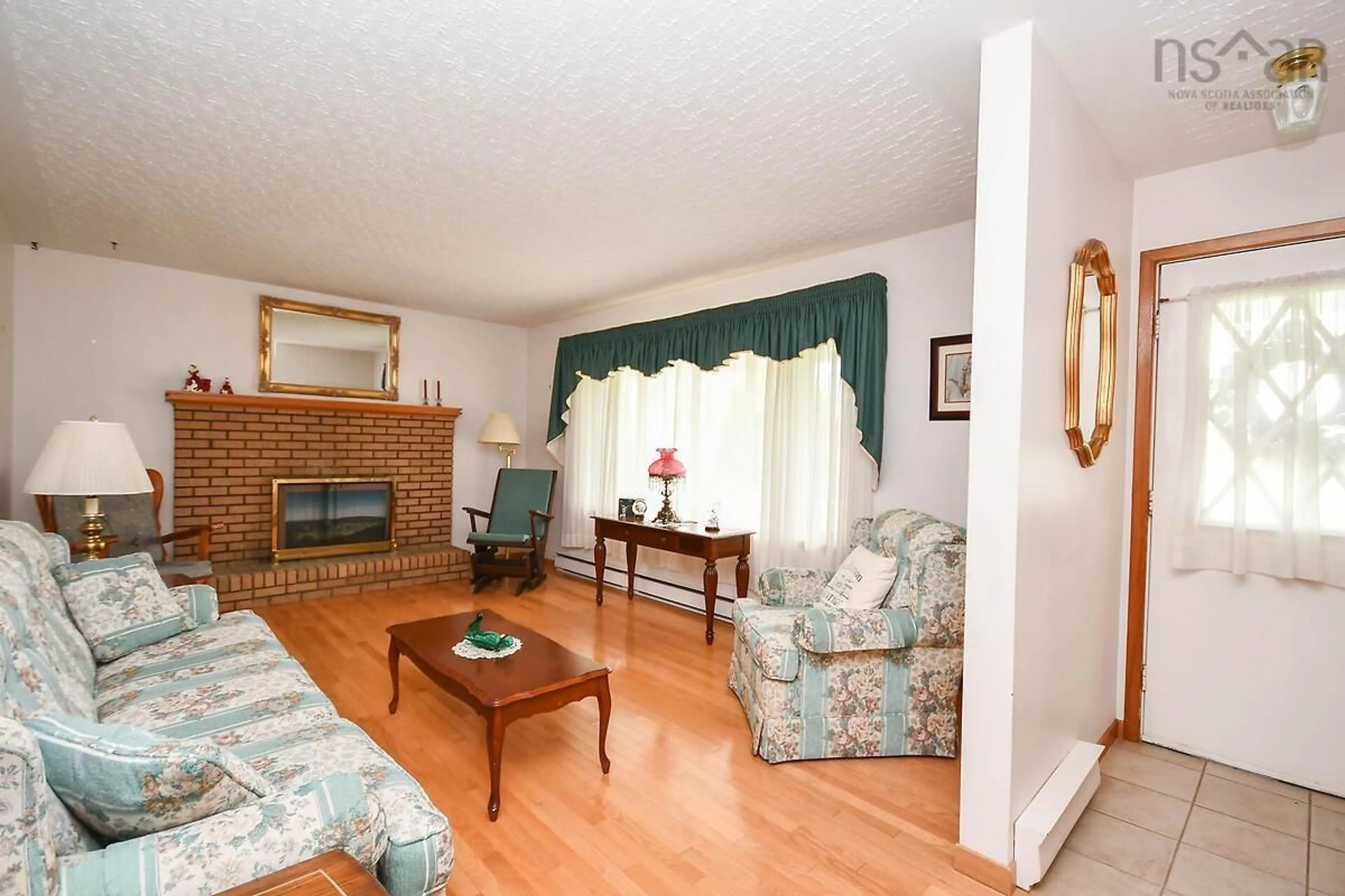 Living room with furniture, wood/laminate floor for 67 Evergreen Dr, Salmon River Nova Scotia B2N 5S7