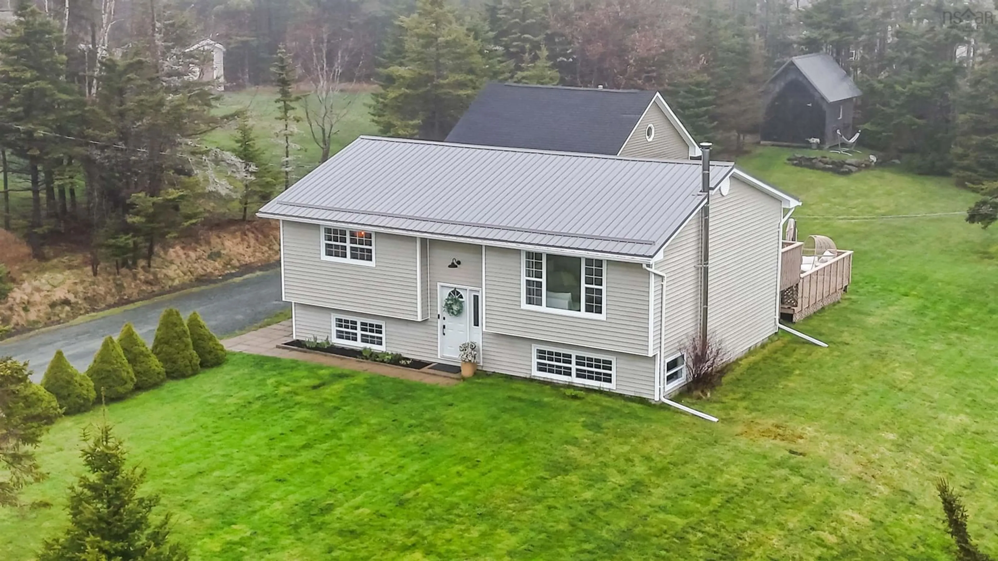 A pic from outside/outdoor area/front of a property/back of a property/a pic from drone, building for 59 Parkwood Dr, East Lawrencetown Nova Scotia B2Z 1P2