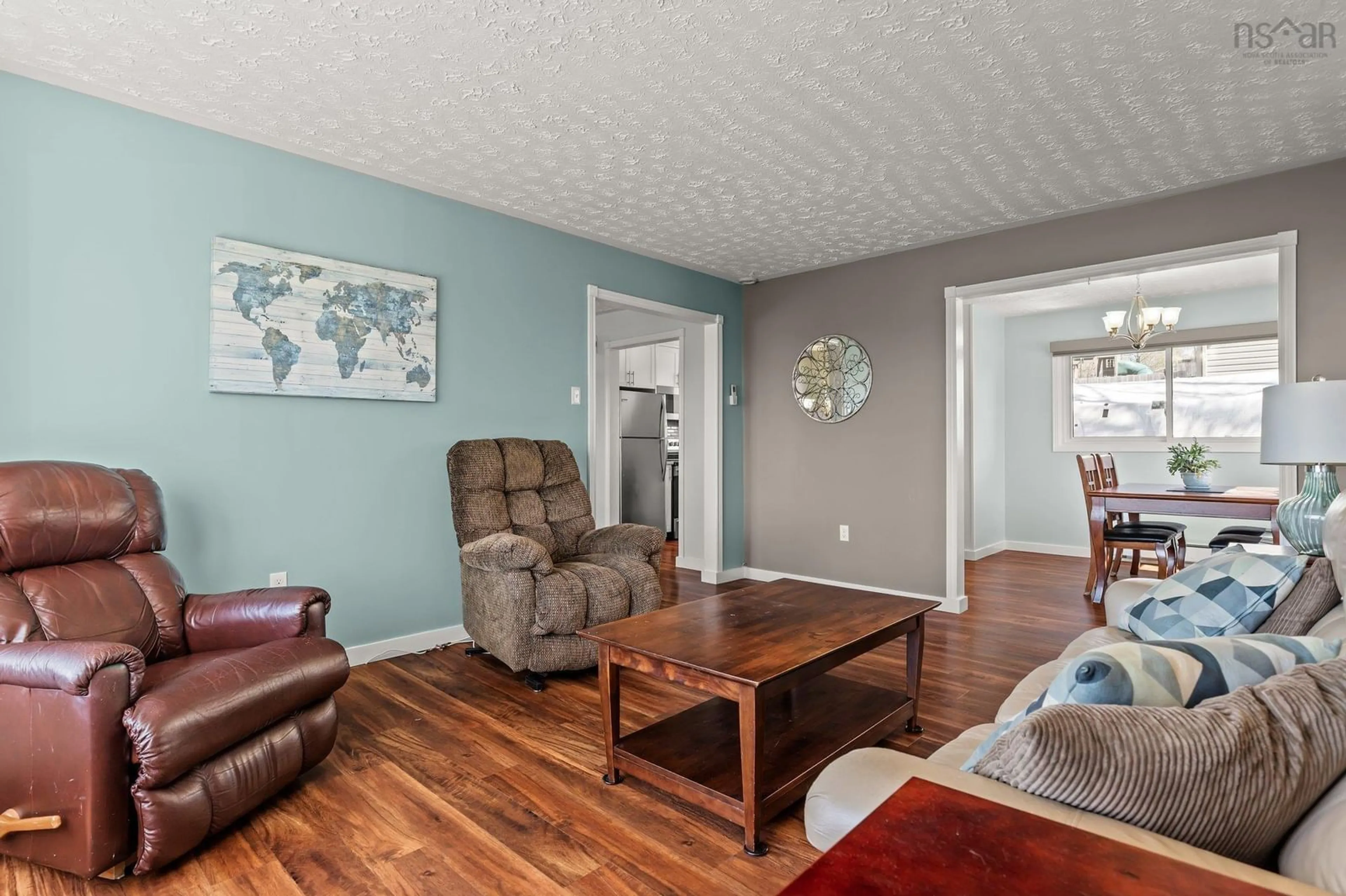 Living room with furniture, wood/laminate floor for 185 Smokey Dr, Lower Sackville Nova Scotia B4C 3B8