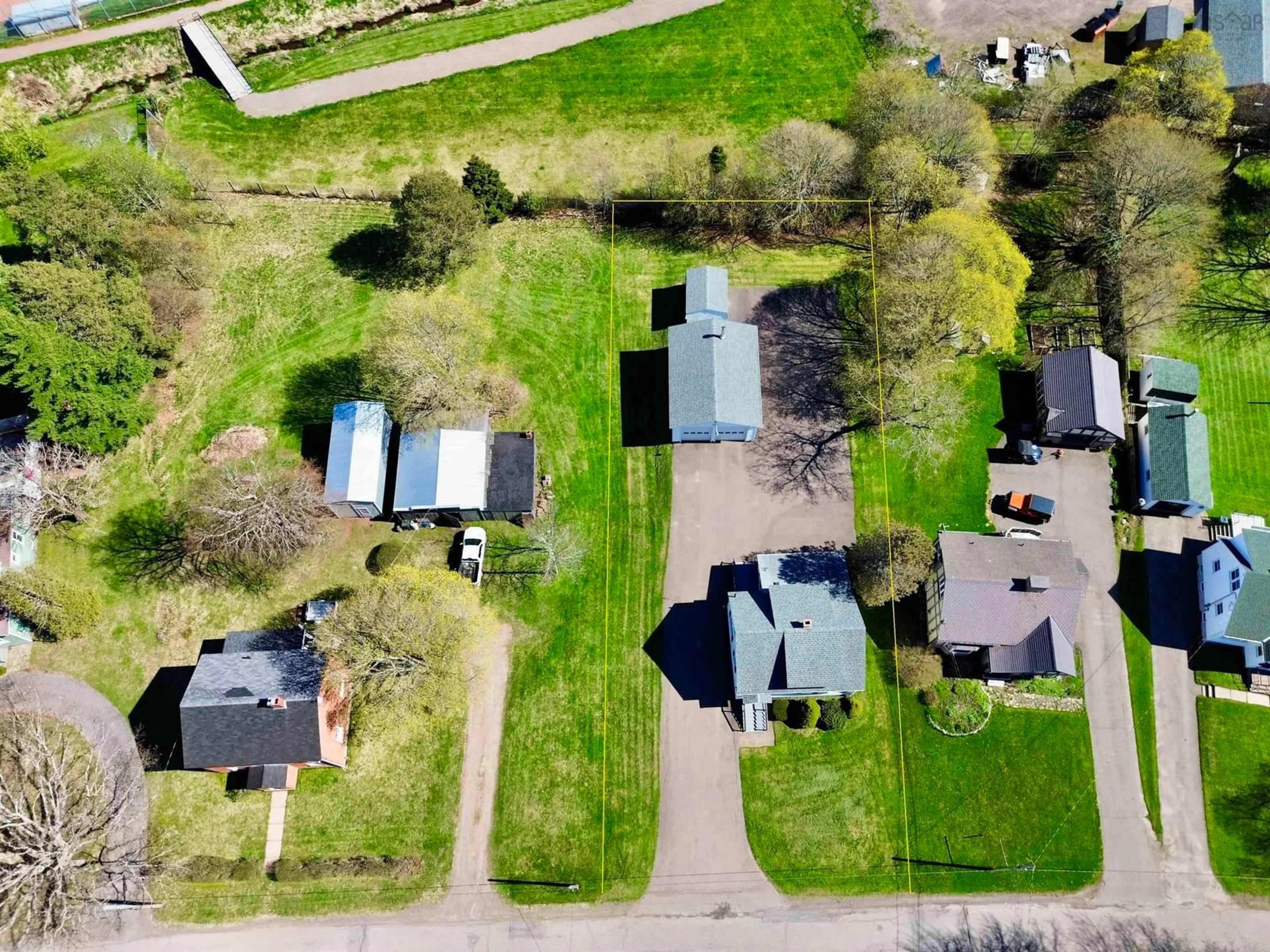A pic from outside/outdoor area/front of a property/back of a property/a pic from drone, street for 5 Queen St, Amherst Nova Scotia B4H 1P7