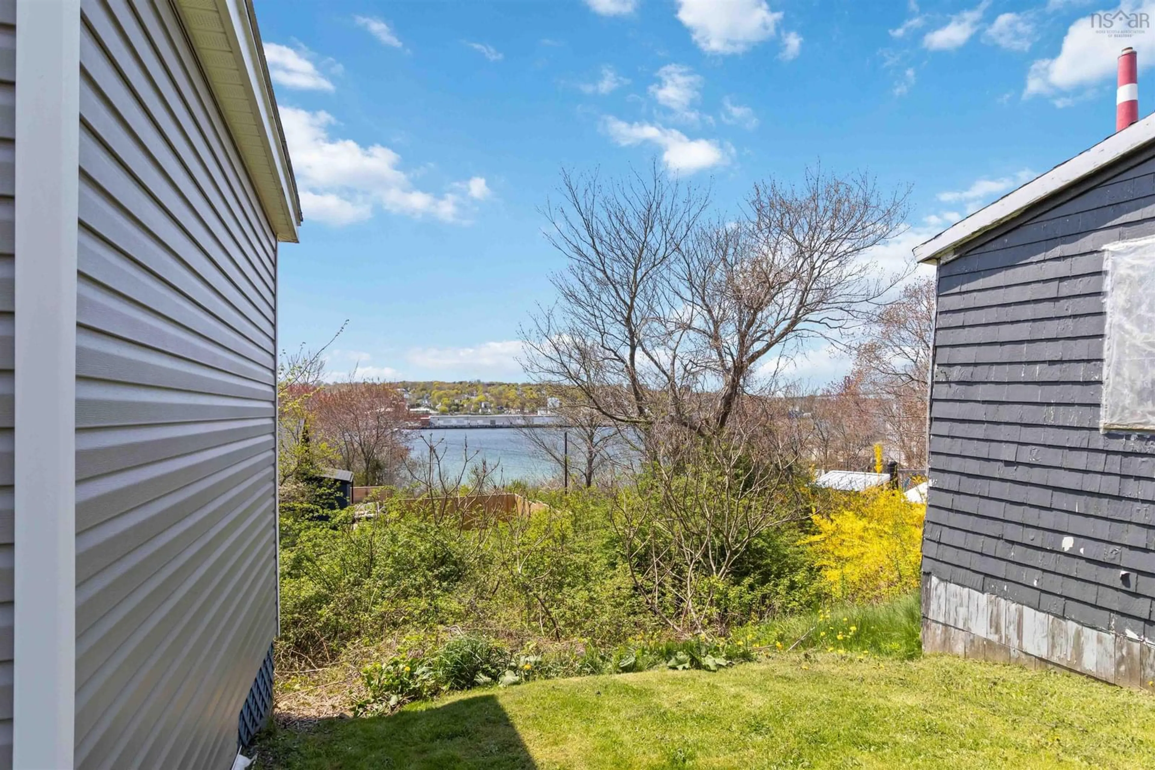 A pic from outside/outdoor area/front of a property/back of a property/a pic from drone, water/lake/river/ocean view for 18 Nivens Ave, Dartmouth Nova Scotia B3A 4B1