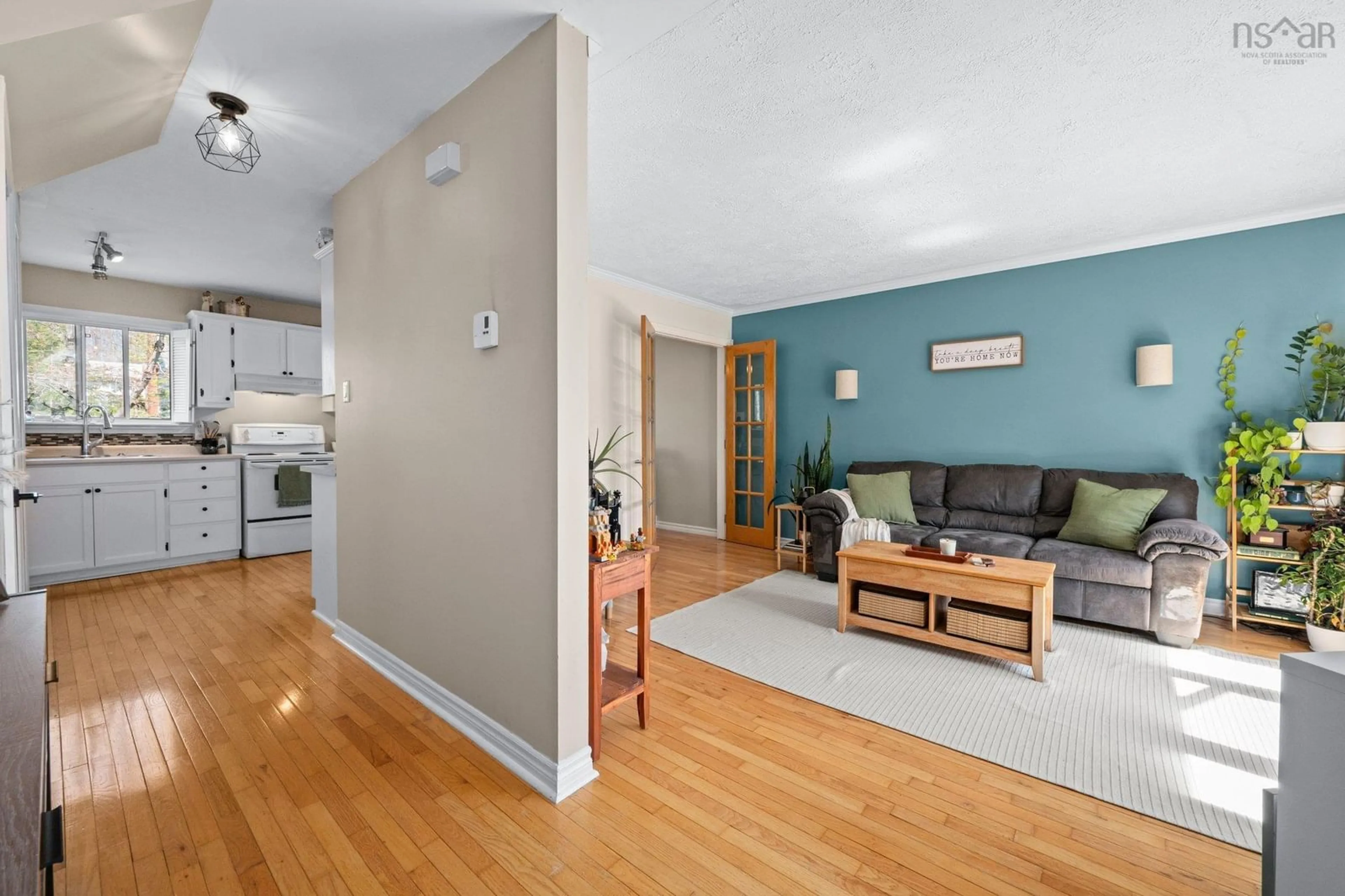 Living room with furniture, wood/laminate floor for 10 Langevin Dr, Lower Sackville Nova Scotia B4C 1P6
