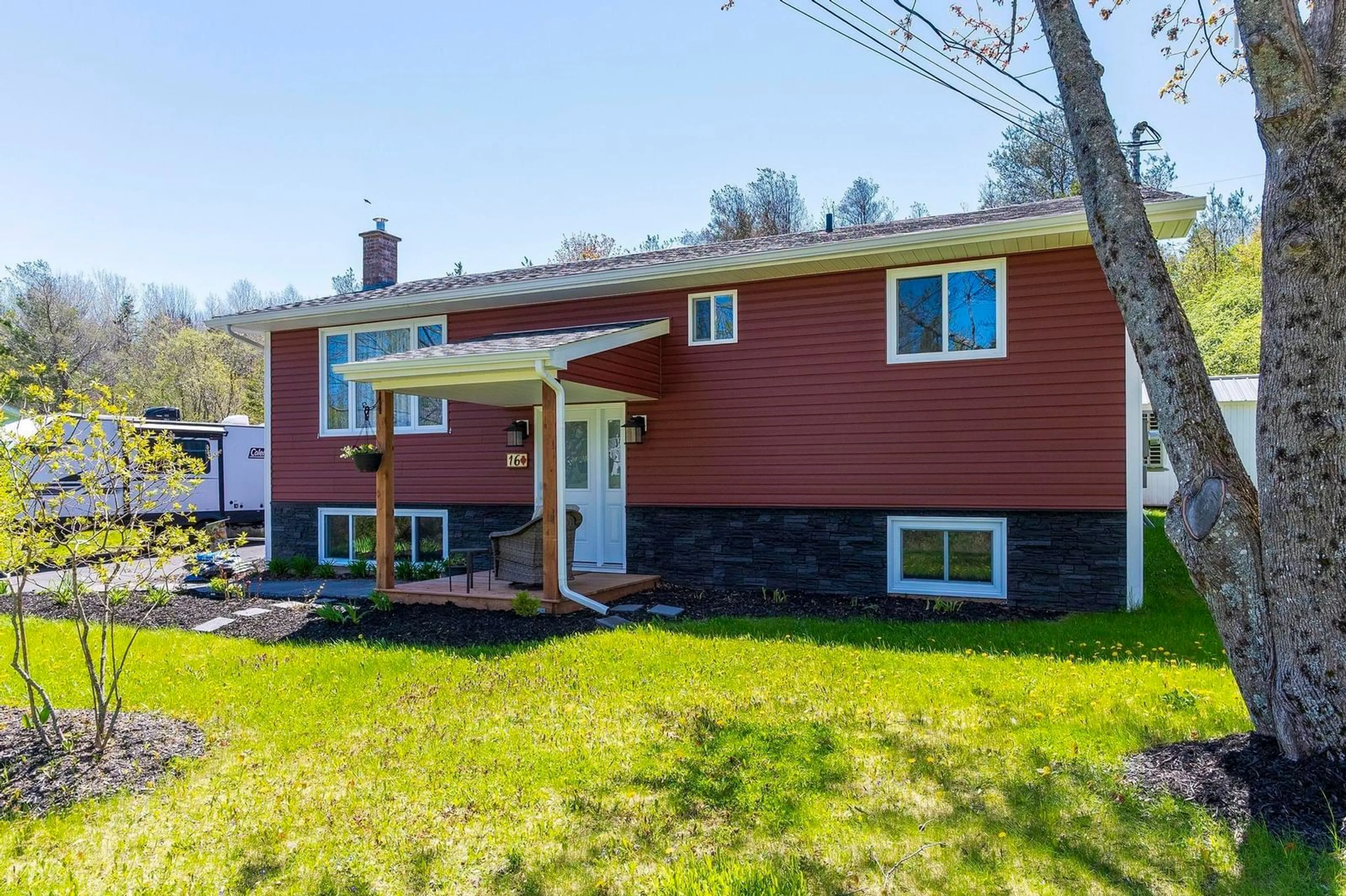 Home with vinyl exterior material, street for 16 Rand St, Hantsport Nova Scotia B0P 1P0