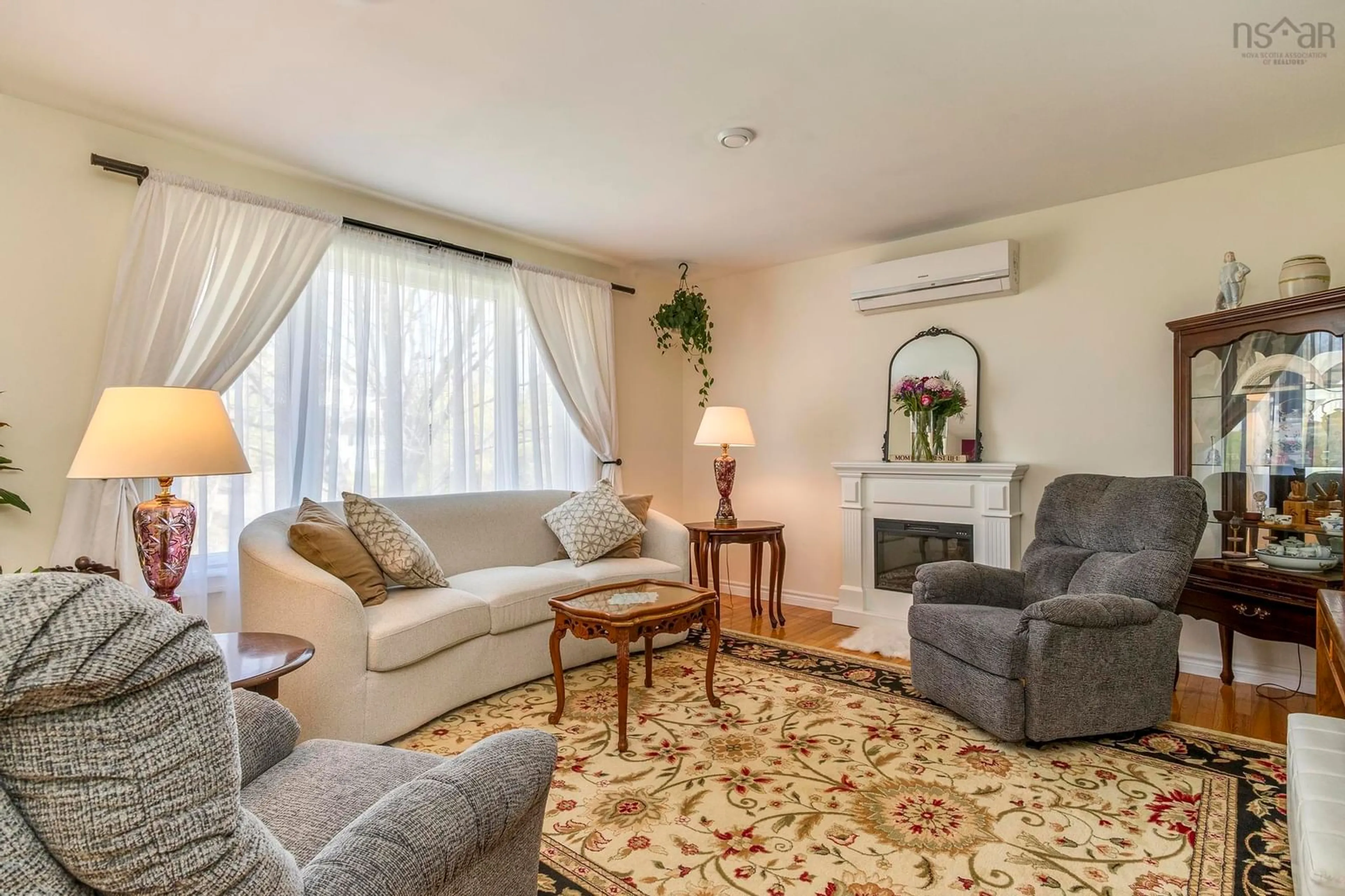 Living room with furniture, carpet floor for 16 Rand St, Hantsport Nova Scotia B0P 1P0