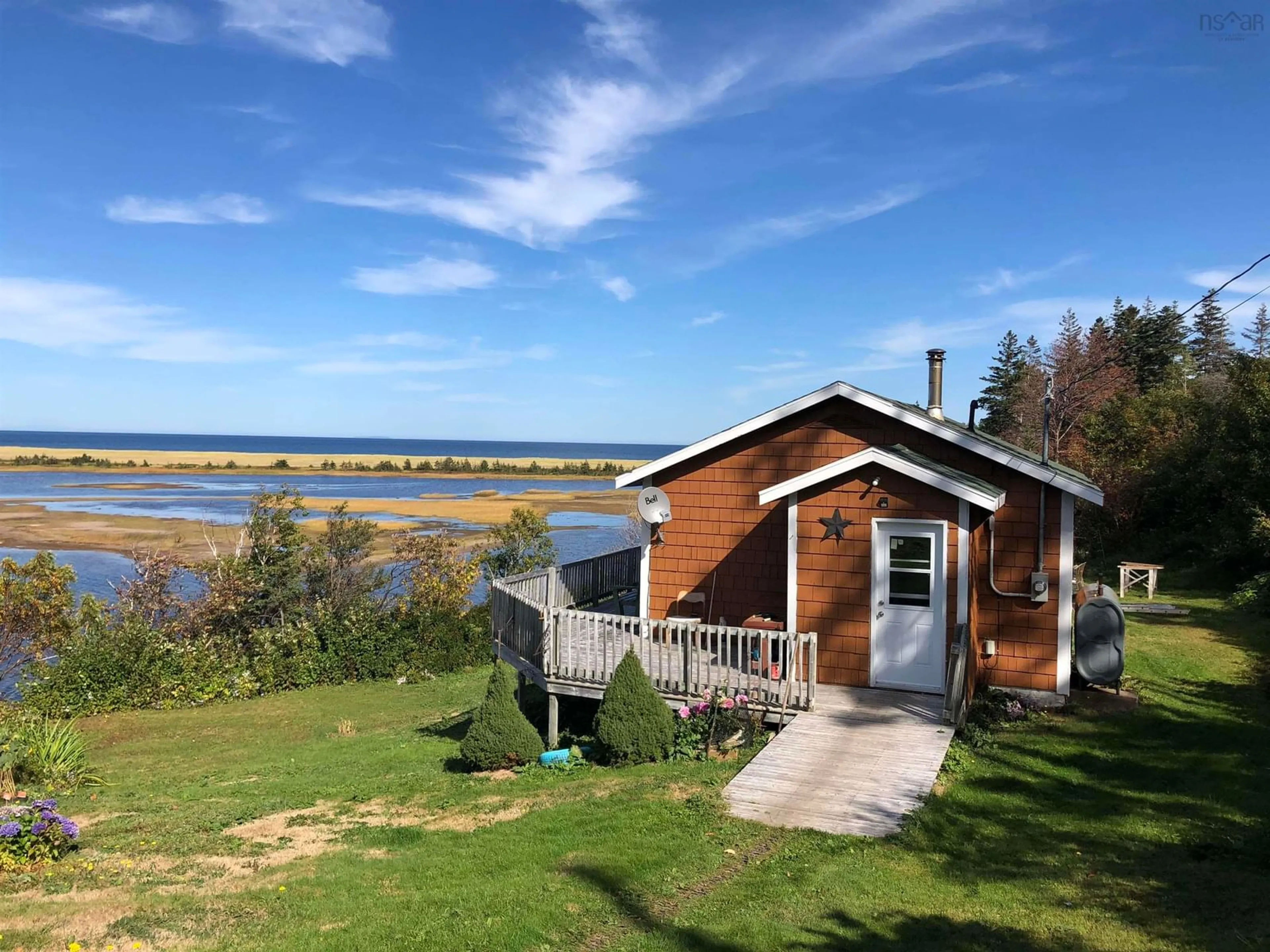 A pic from outside/outdoor area/front of a property/back of a property/a pic from drone, water/lake/river/ocean view for 659 White Point Rd, South Harbour Nova Scotia B0C 1G0