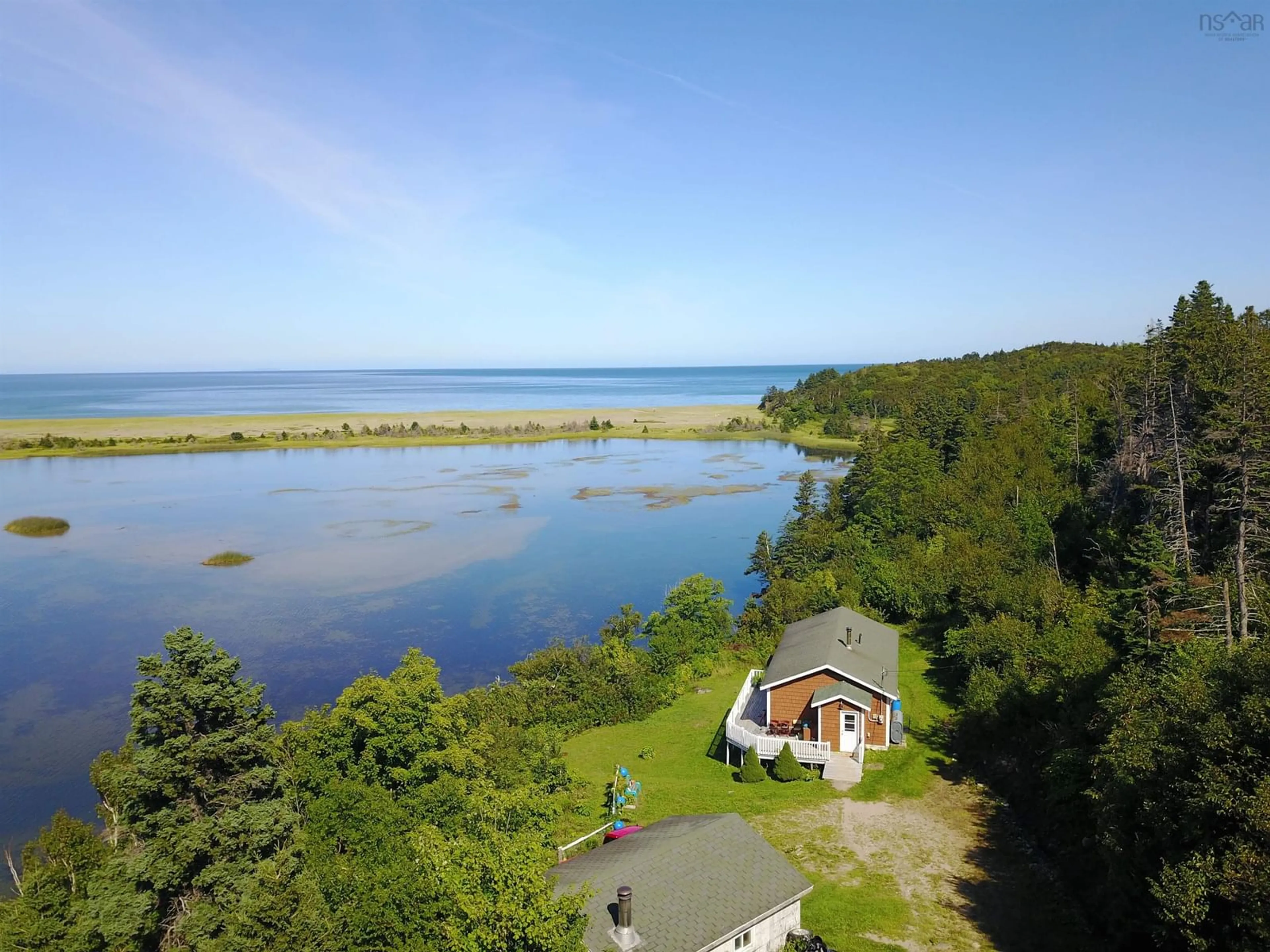 A pic from outside/outdoor area/front of a property/back of a property/a pic from drone, water/lake/river/ocean view for 659 White Point Rd, South Harbour Nova Scotia B0C 1G0