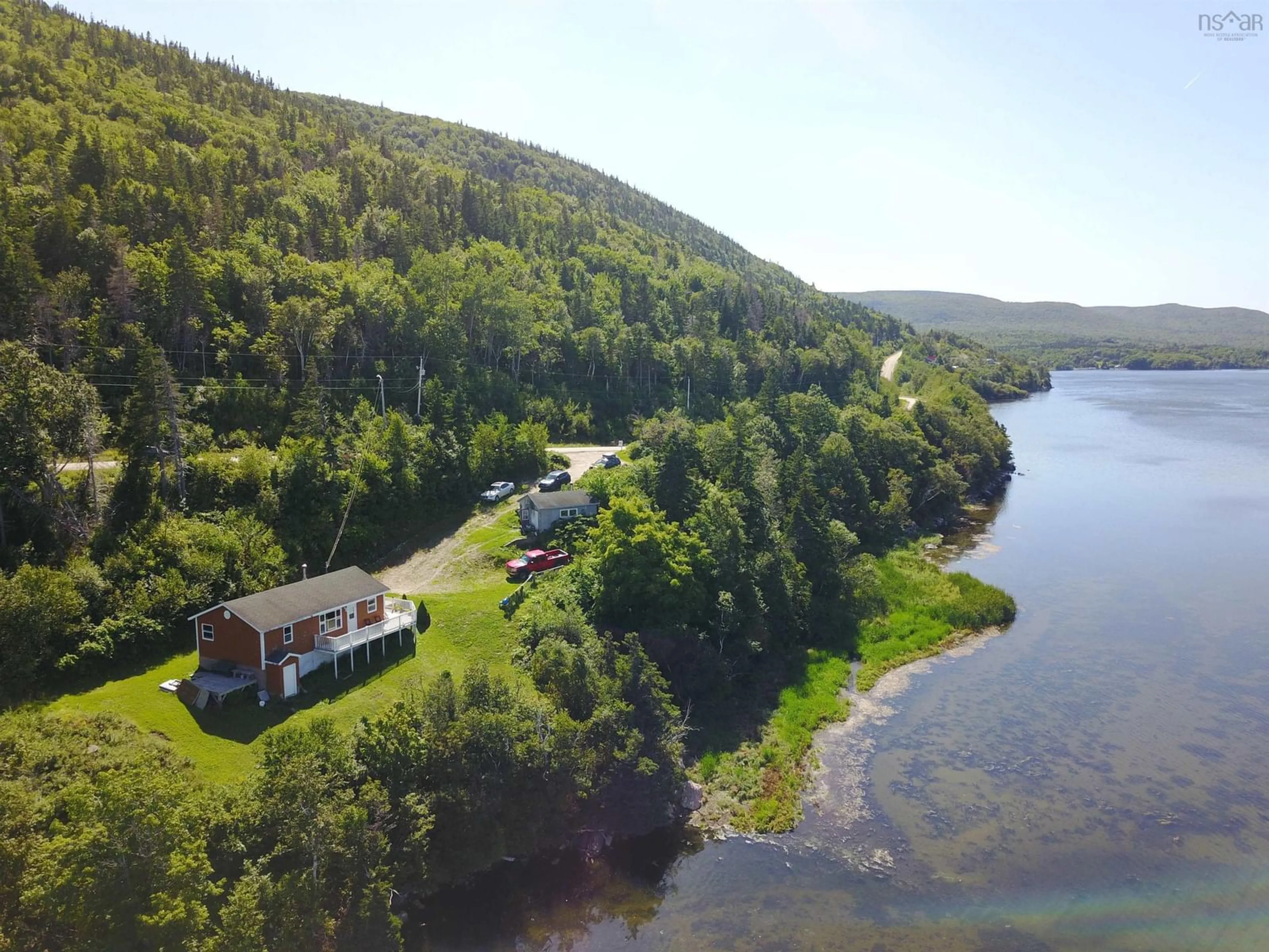 A pic from outside/outdoor area/front of a property/back of a property/a pic from drone, water/lake/river/ocean view for 659 White Point Rd, South Harbour Nova Scotia B0C 1G0