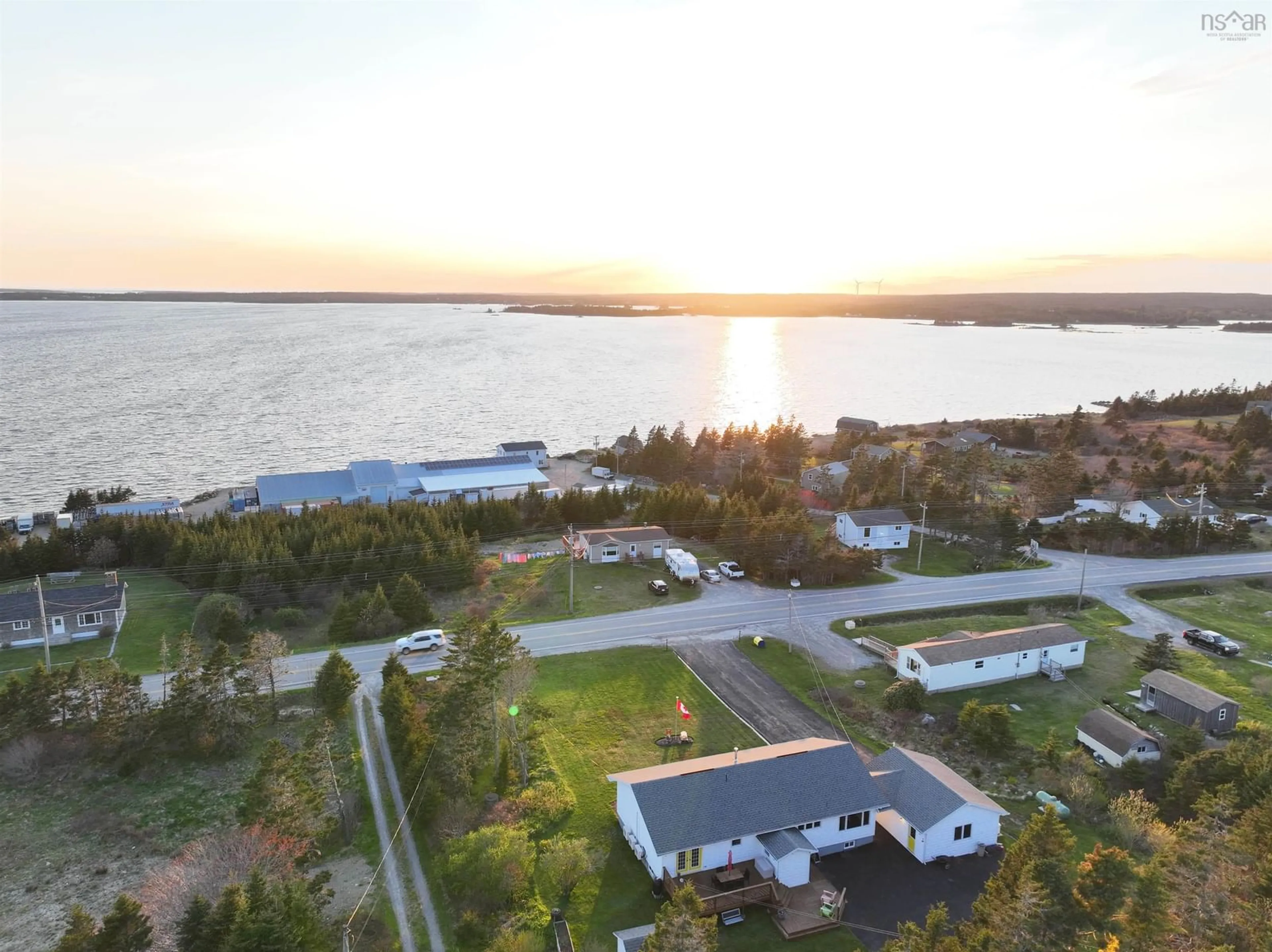 A pic from outside/outdoor area/front of a property/back of a property/a pic from drone, water/lake/river/ocean view for 521 330 Hwy, North East Point Nova Scotia B0W 2P0