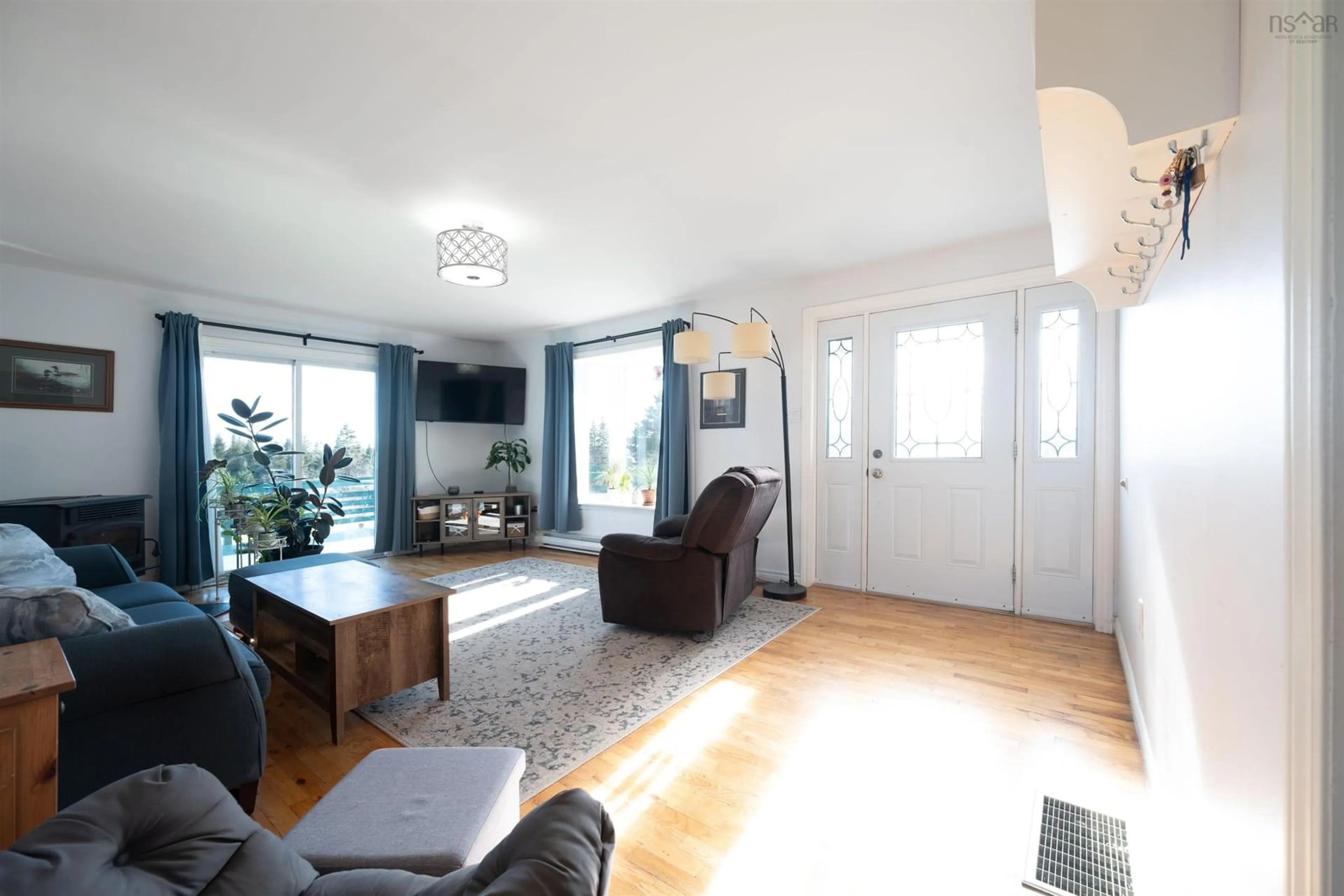 Living room with furniture, wood/laminate floor for 88 Barkhouse Settlement Rd, Port Dufferin Nova Scotia B0J 2R0