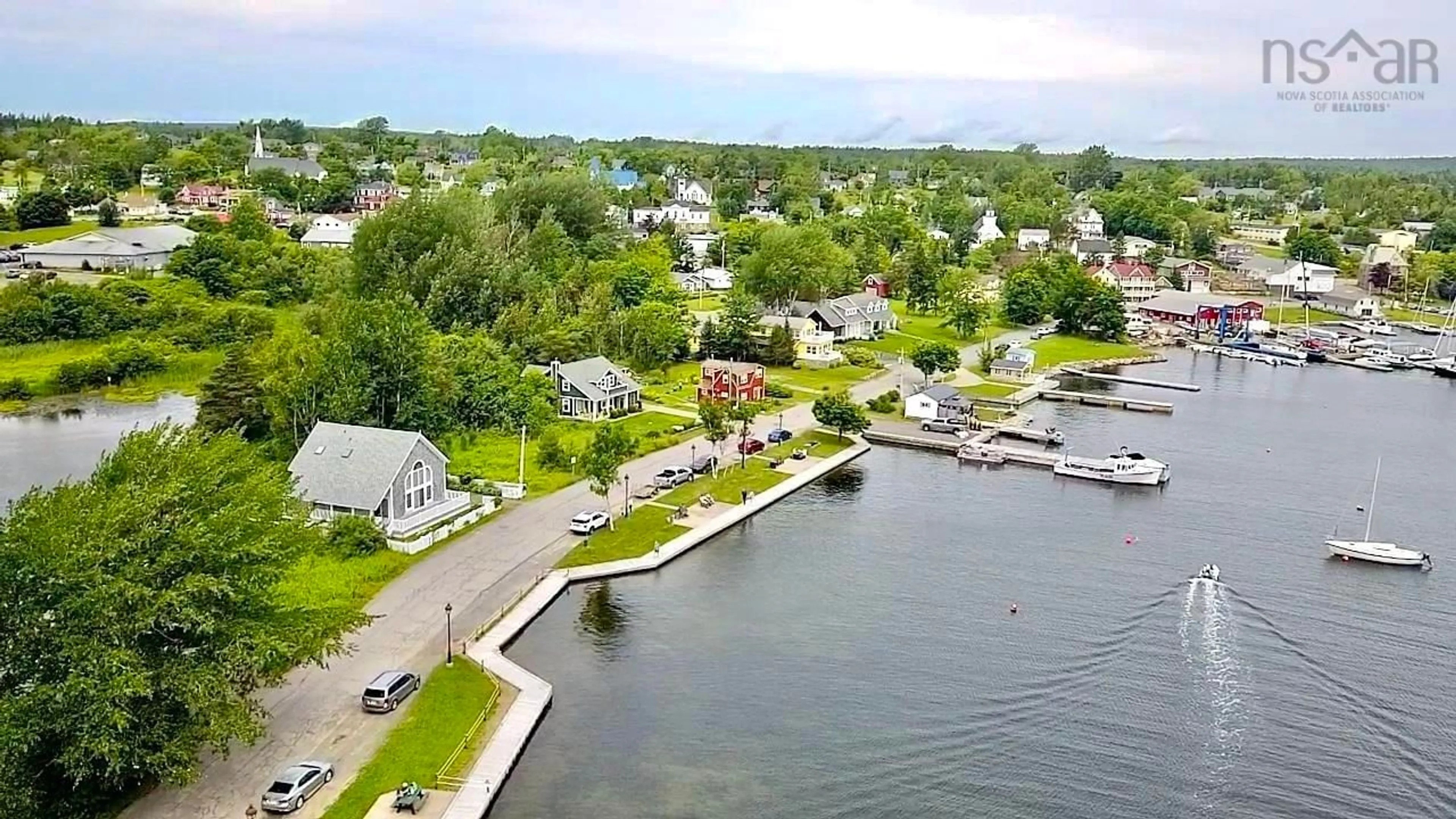 A pic from outside/outdoor area/front of a property/back of a property/a pic from drone, water/lake/river/ocean view for 70 Water St, Baddeck Nova Scotia B0E 1B0