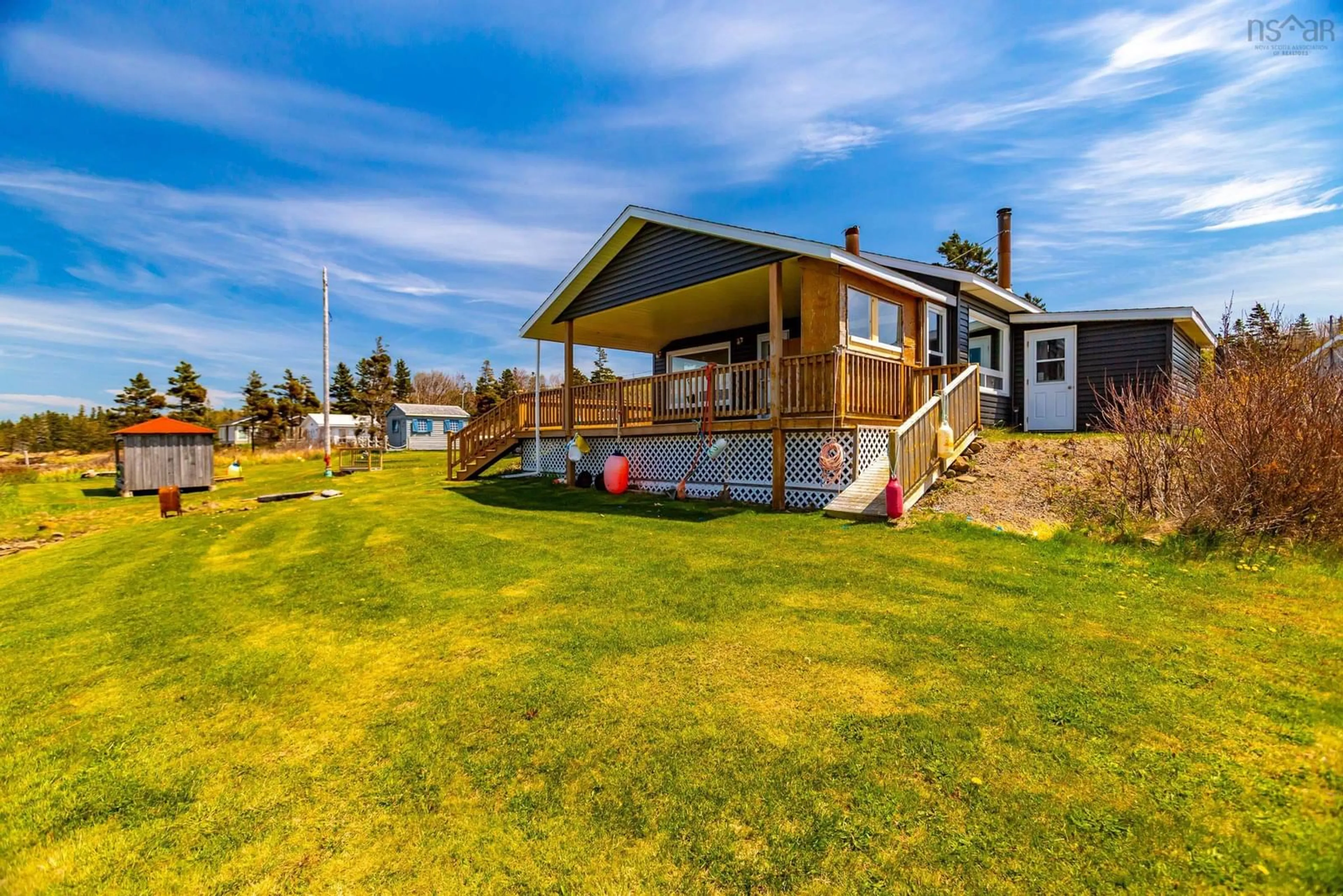 A pic from outside/outdoor area/front of a property/back of a property/a pic from drone, water/lake/river/ocean view for 41 Sunset Ave, Phinneys Cove Nova Scotia B0S 1L0