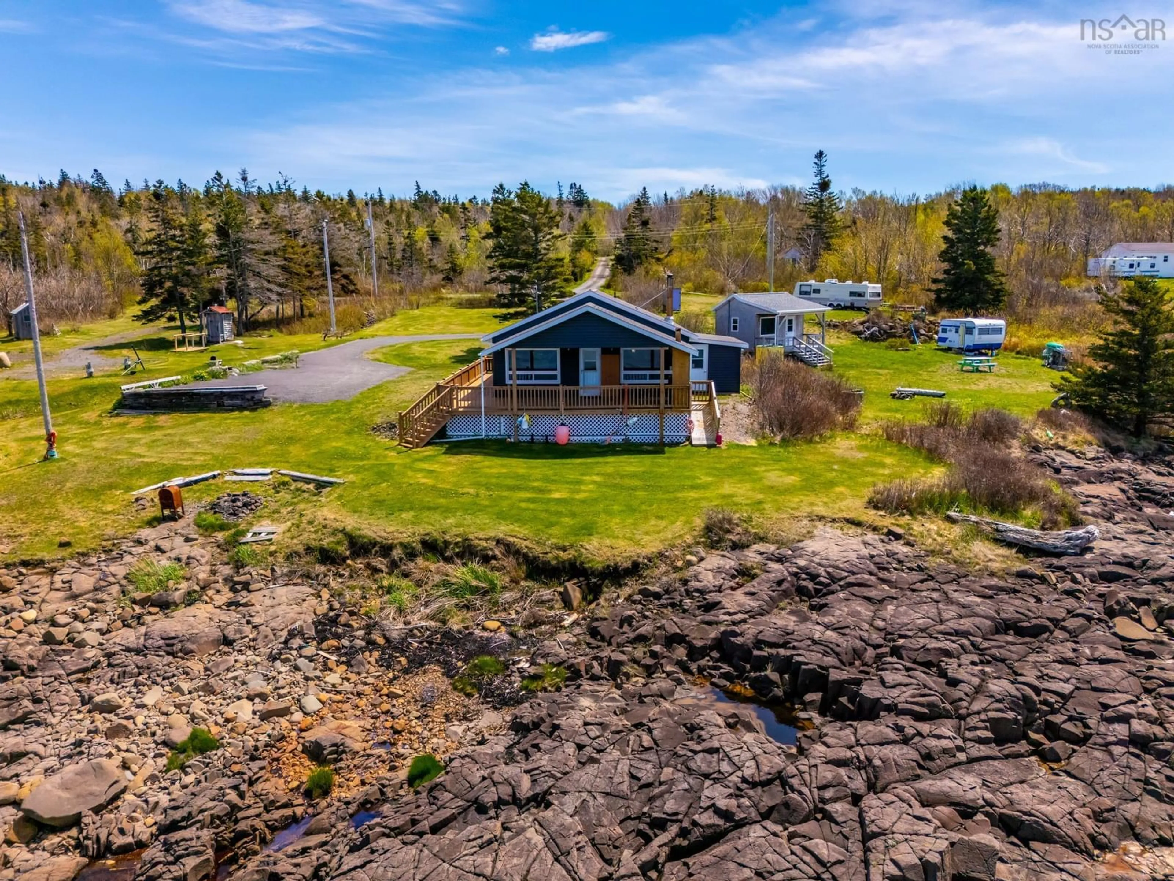 A pic from outside/outdoor area/front of a property/back of a property/a pic from drone, water/lake/river/ocean view for 41 Sunset Ave, Phinneys Cove Nova Scotia B0S 1L0