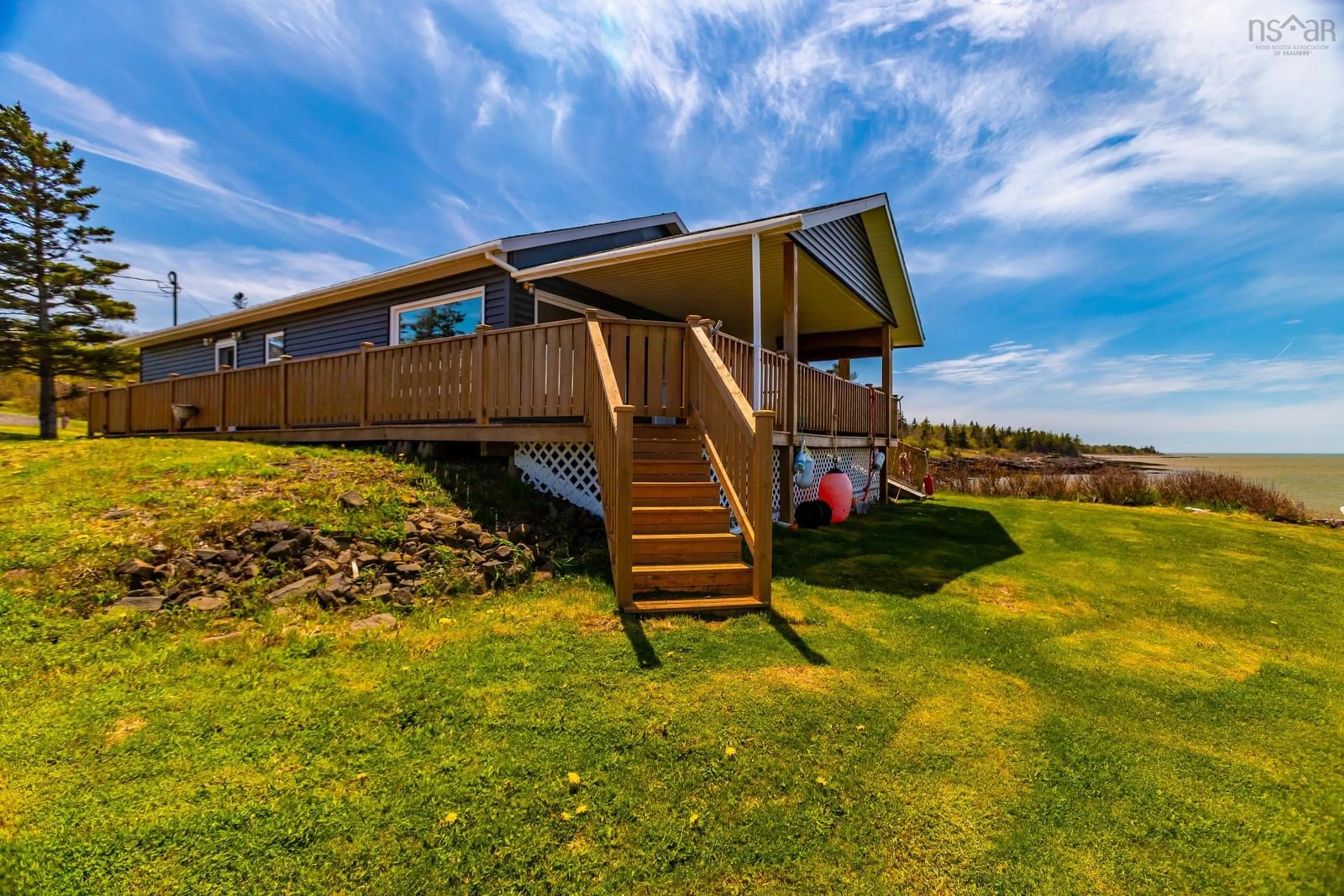 A pic from outside/outdoor area/front of a property/back of a property/a pic from drone, water/lake/river/ocean view for 41 Sunset Ave, Phinneys Cove Nova Scotia B0S 1L0