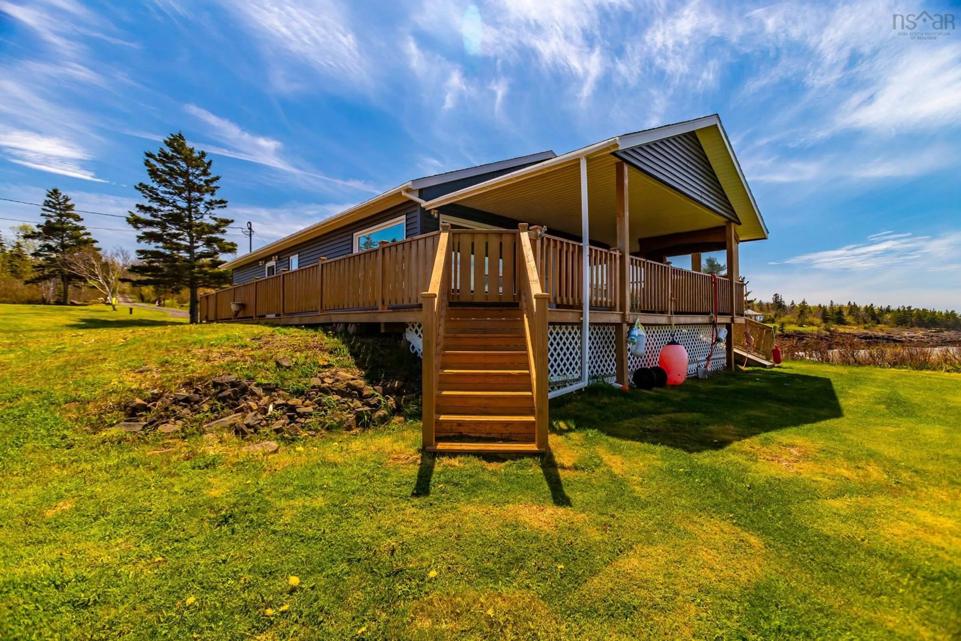 A pic from outside/outdoor area/front of a property/back of a property/a pic from drone, water/lake/river/ocean view for 41 Sunset Ave, Phinneys Cove Nova Scotia B0S 1L0