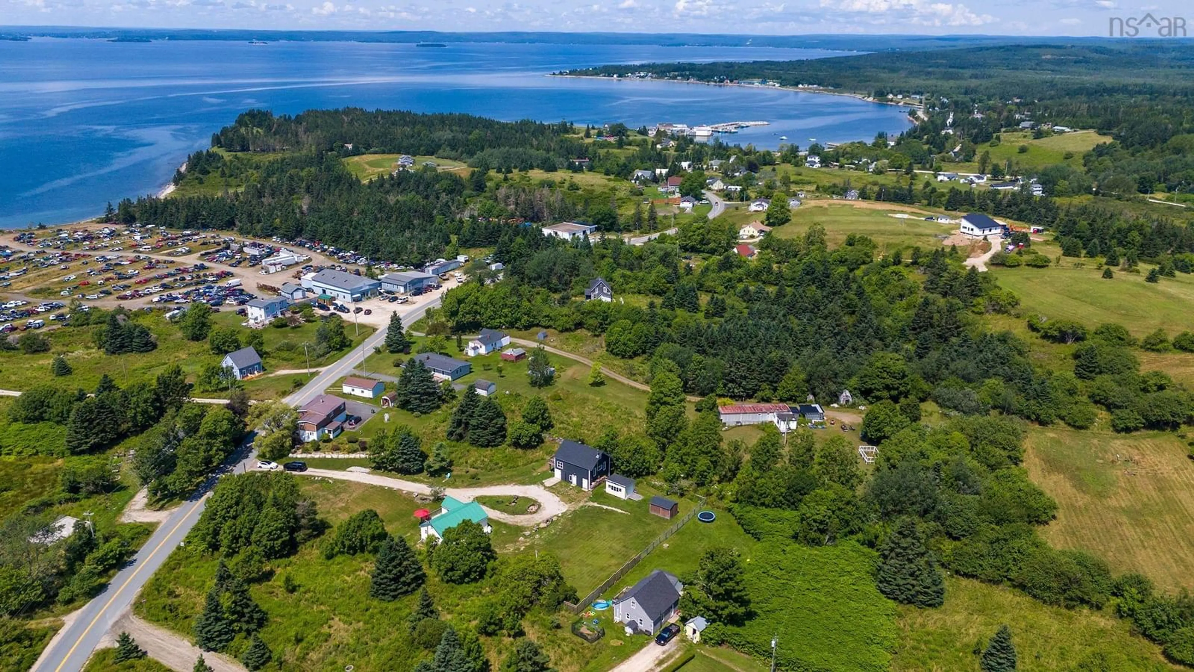 A pic from outside/outdoor area/front of a property/back of a property/a pic from drone, water/lake/river/ocean view for 173 New Harbour Rd, Blandford Nova Scotia B0J 1T0