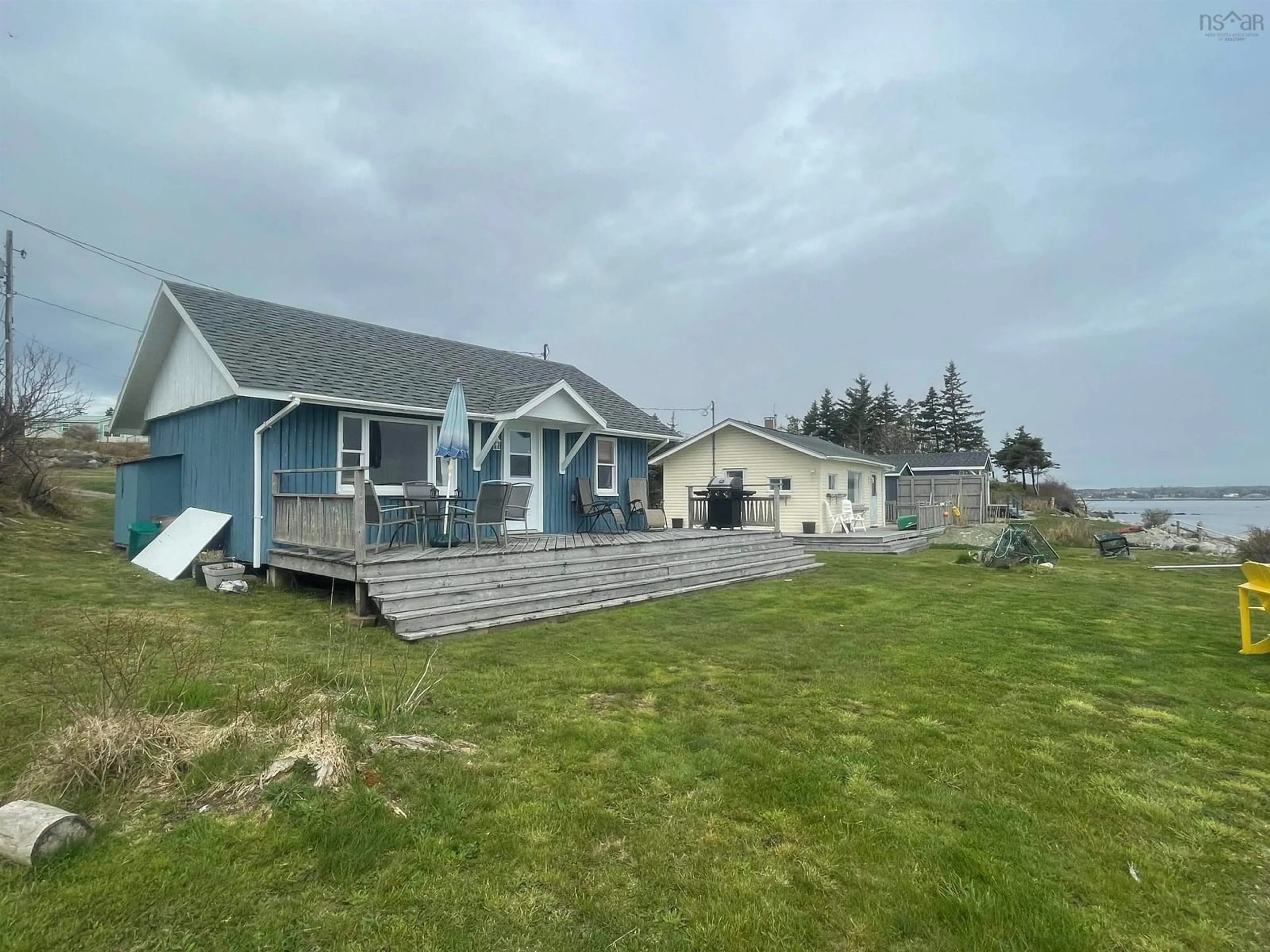 A pic from outside/outdoor area/front of a property/back of a property/a pic from drone, water/lake/river/ocean view for 47 Cabin Rd, North East Point Nova Scotia B0W 2P0