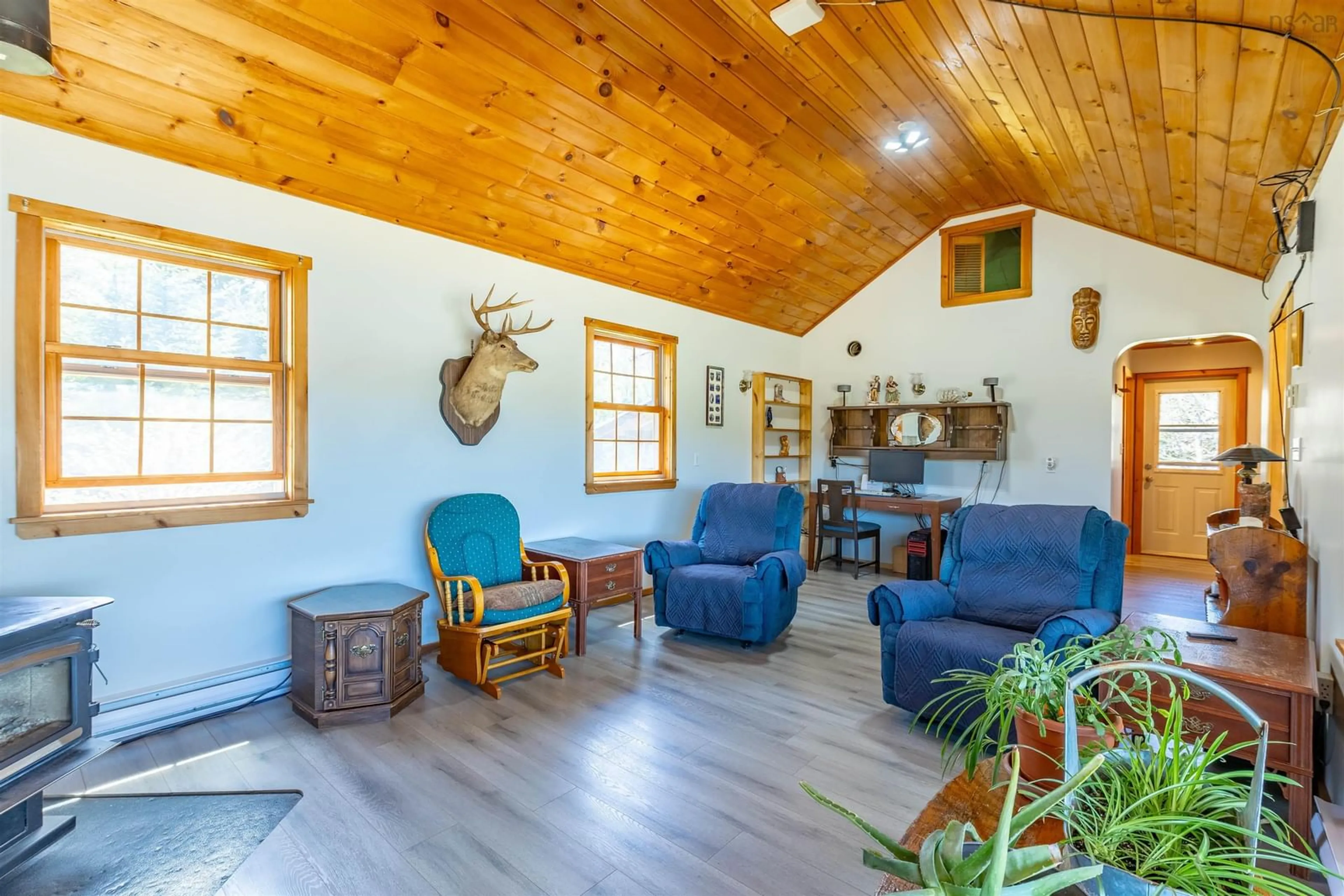Living room with furniture, wood/laminate floor for 1202 Boutilier Branch Rd, Kemptville Nova Scotia B5A 5P3