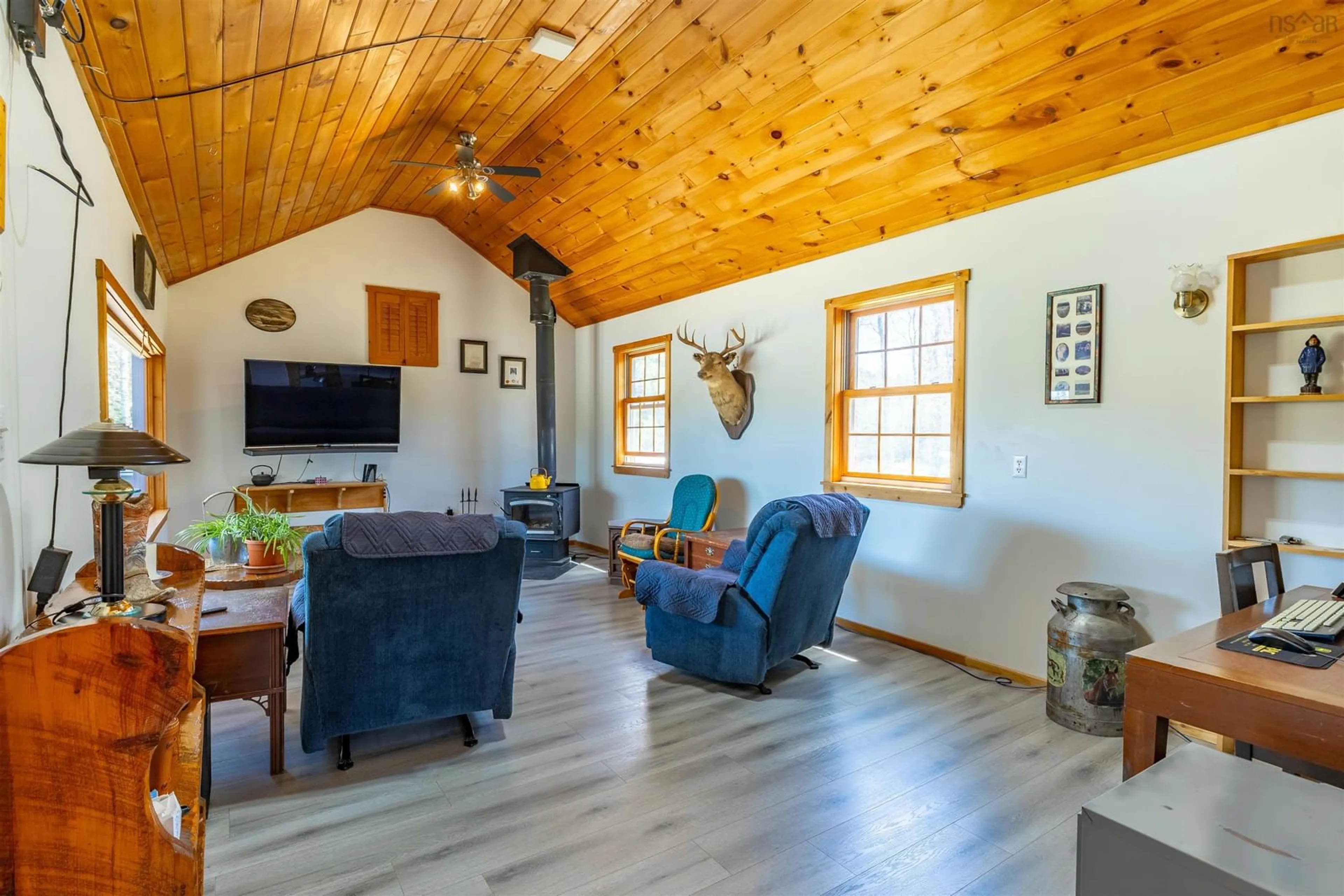 Living room with furniture, wood/laminate floor for 1202 Boutilier Branch Rd, Kemptville Nova Scotia B5A 5P3