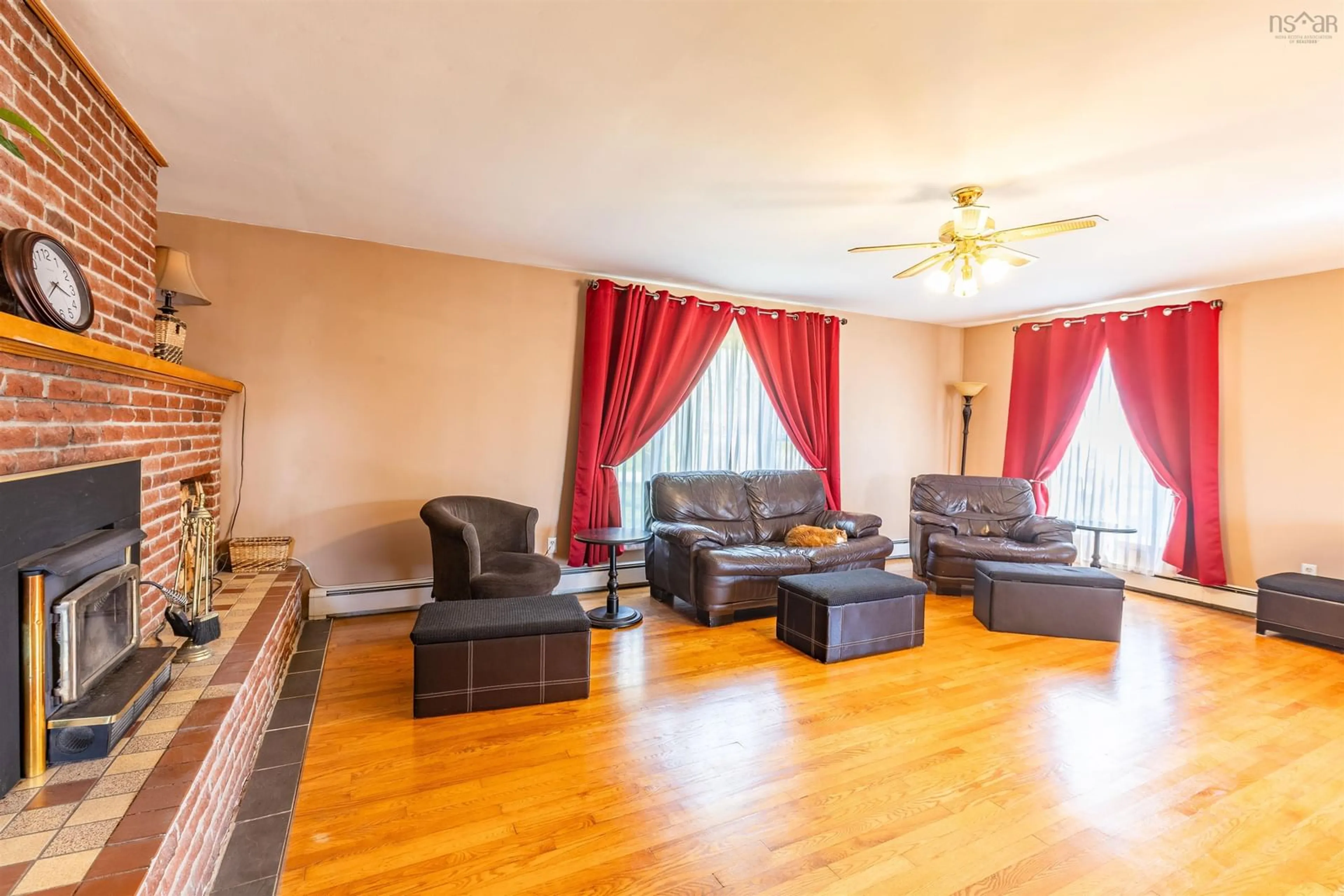 Living room with furniture, wood/laminate floor for 16 Goodwin Dr, Dayton Nova Scotia B5A 4H8