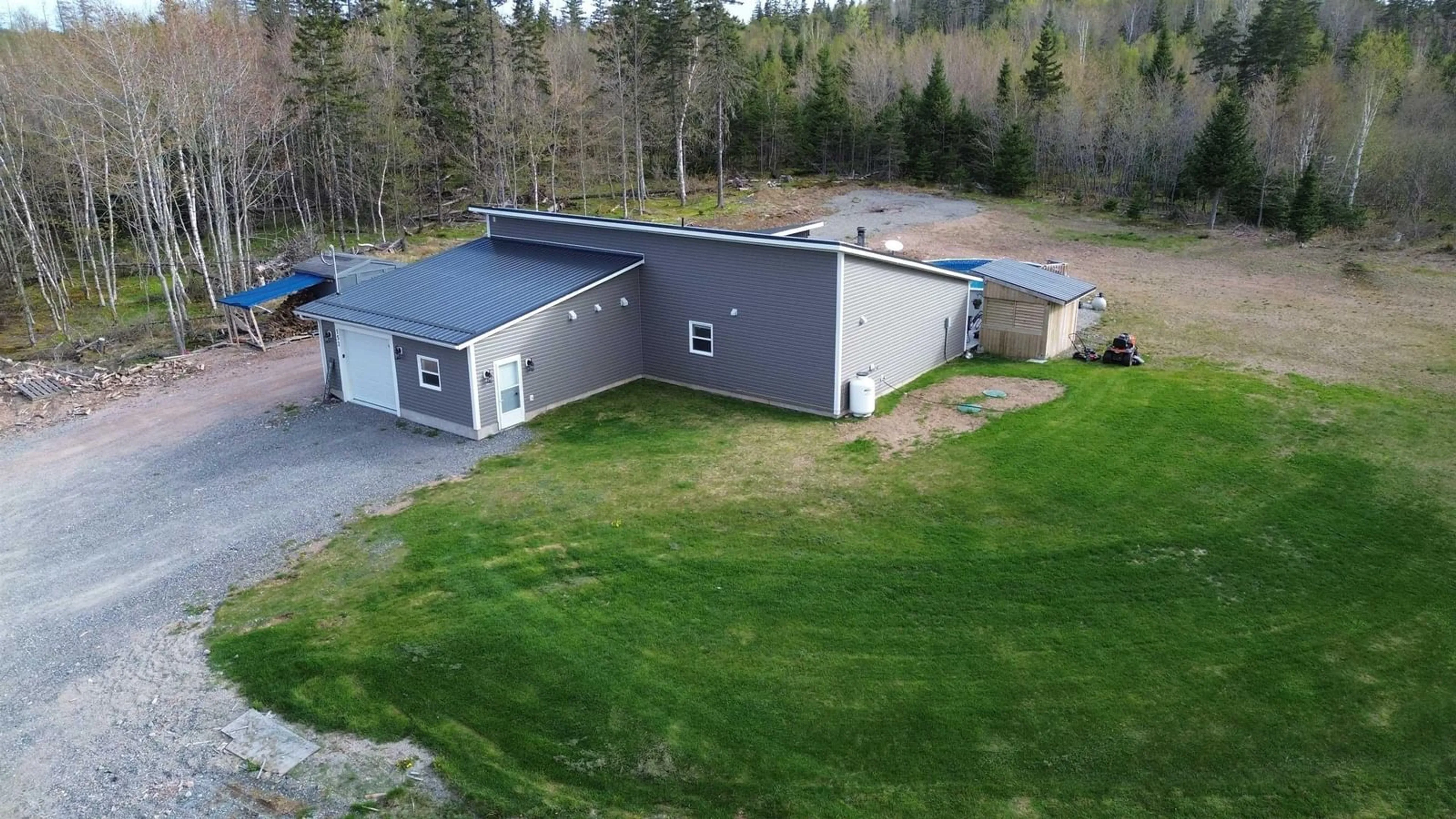 A pic from outside/outdoor area/front of a property/back of a property/a pic from drone, building for 152 Beaton Rd, Coxheath Nova Scotia B1L 1A9