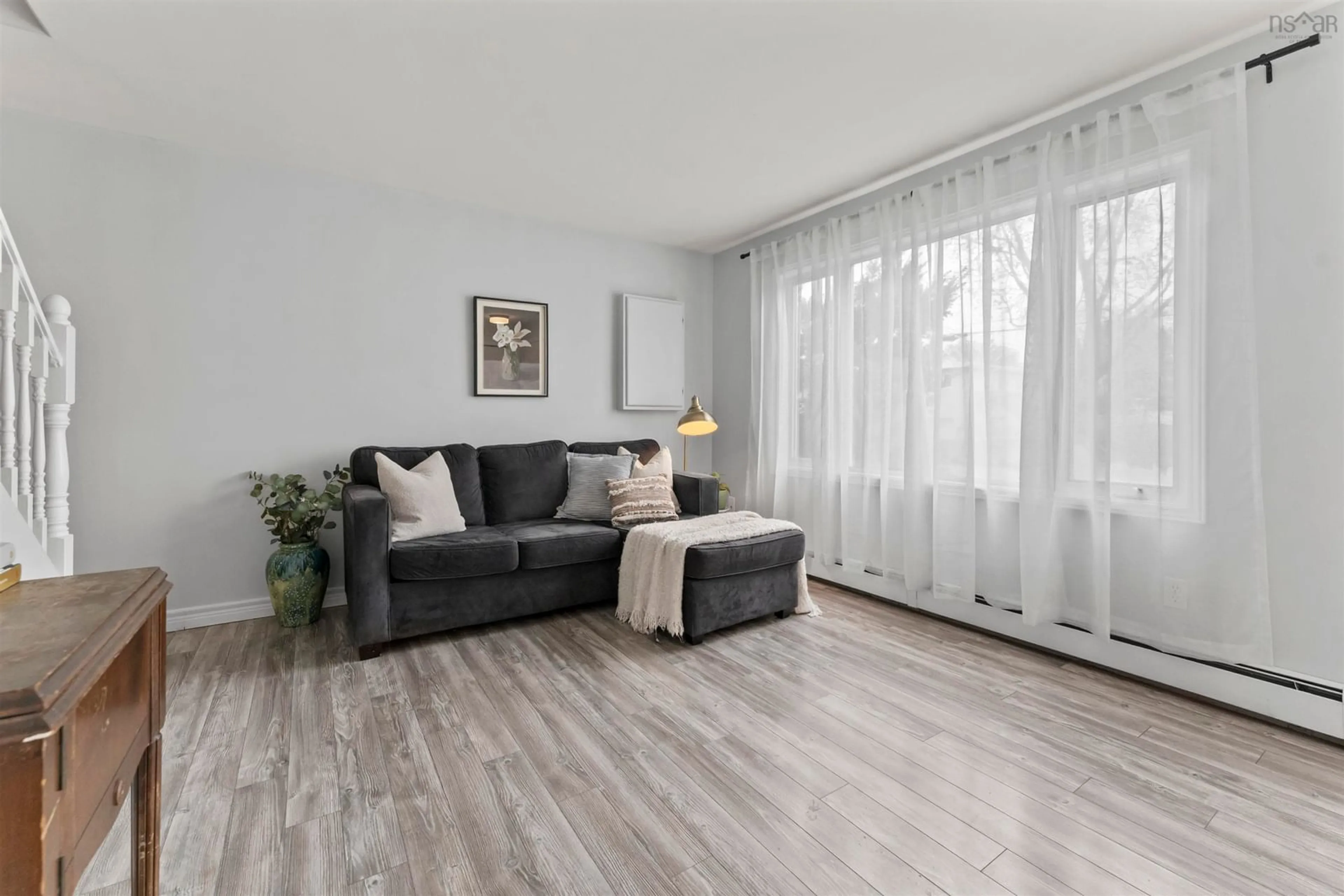 Living room with furniture, wood/laminate floor for 3 Brookhouse Rd, Dartmouth Nova Scotia B2W 1W5