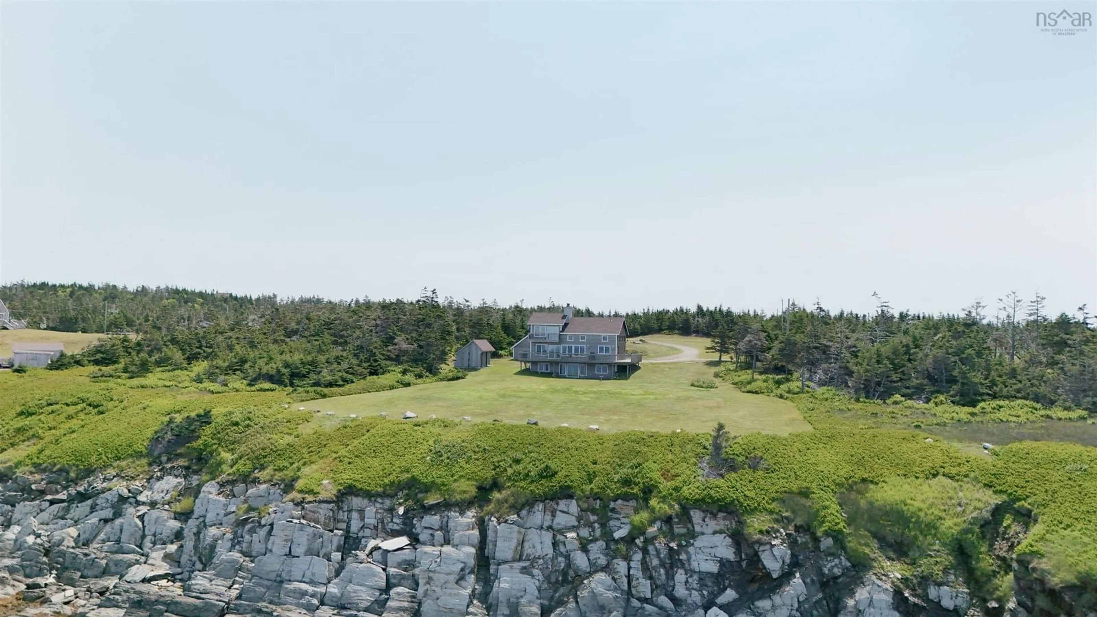 A pic from outside/outdoor area/front of a property/back of a property/a pic from drone, water/lake/river/ocean view for 194 Thomas Rd, Cape Forchu Nova Scotia B5A 5G7