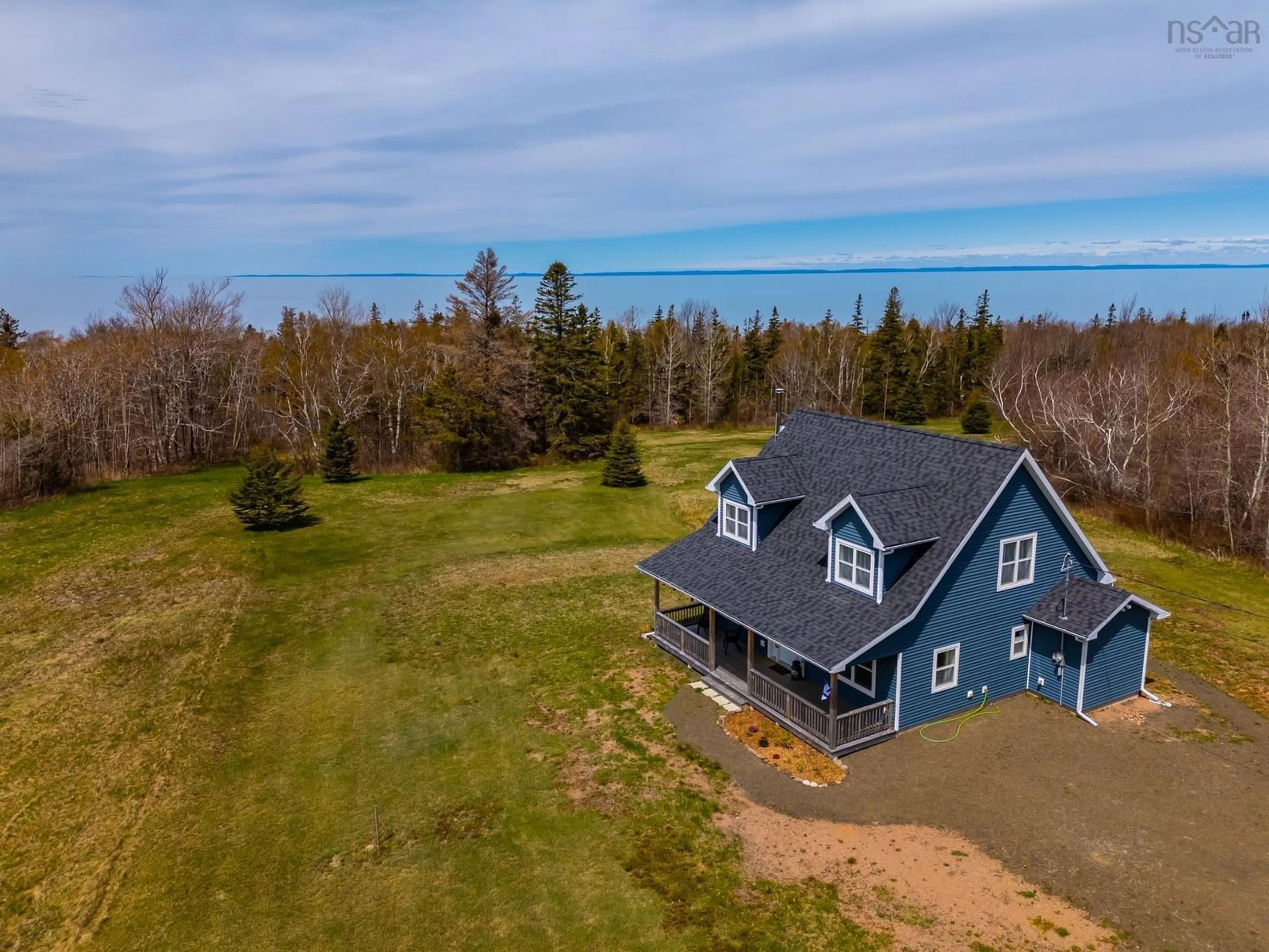 A pic from outside/outdoor area/front of a property/back of a property/a pic from drone, water/lake/river/ocean view for 7295 Shore Rd, Phinneys Cove Nova Scotia B0S 1L0