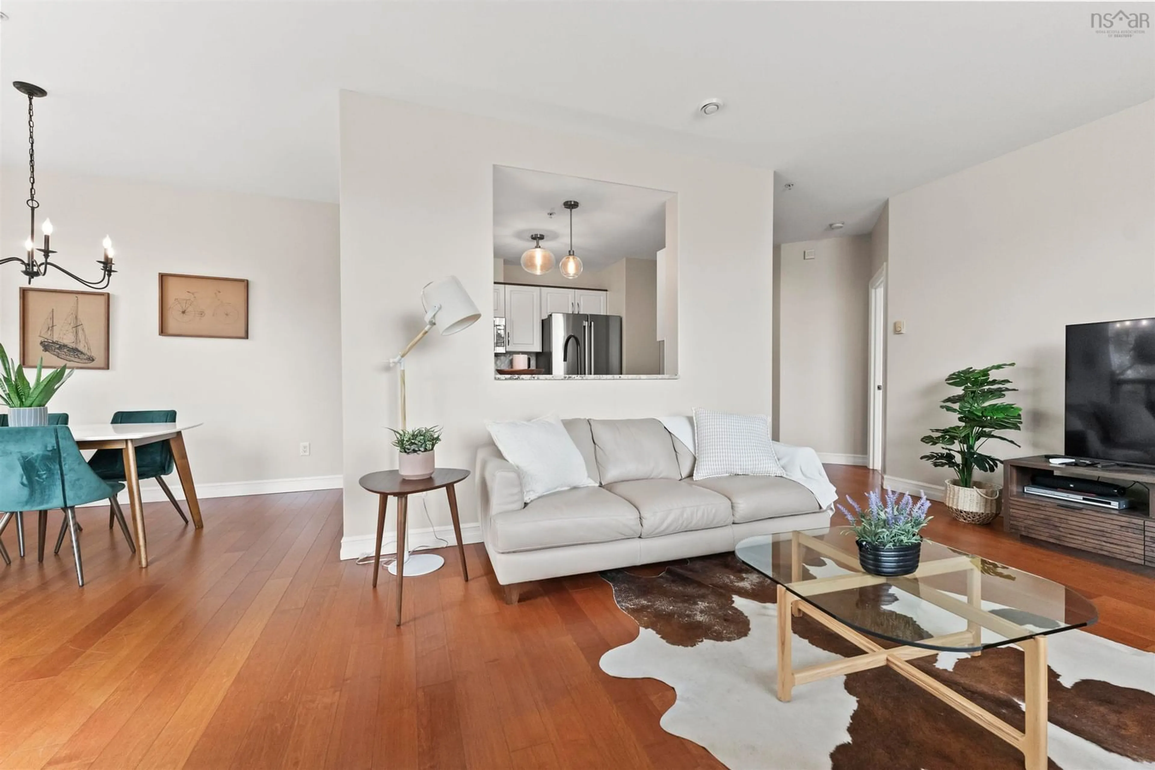 Living room with furniture, wood/laminate floor for 2677 Gladstone St #102, Halifax Nova Scotia B3K 0A3