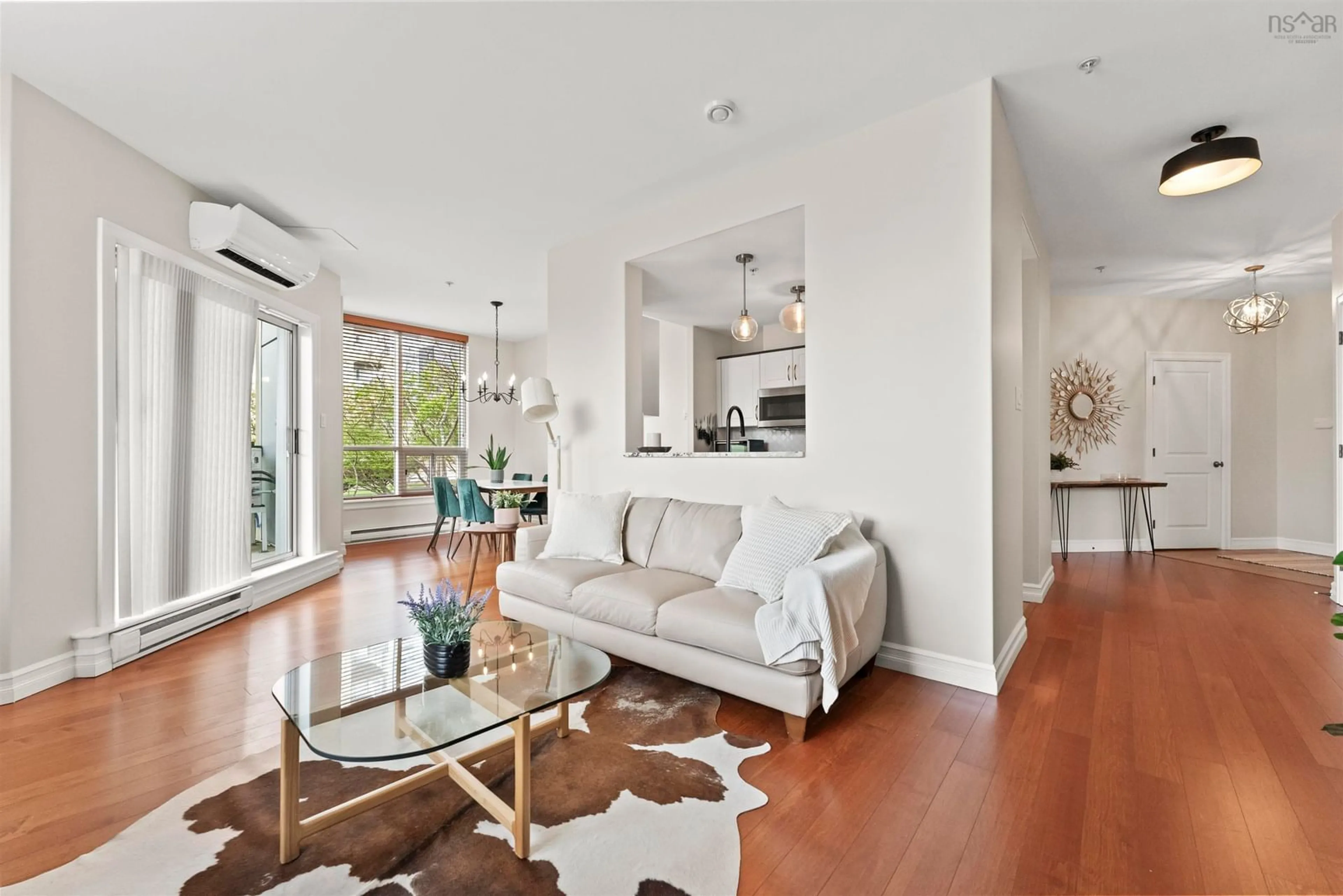 Living room with furniture, wood/laminate floor for 2677 Gladstone St #102, Halifax Nova Scotia B3K 0A3