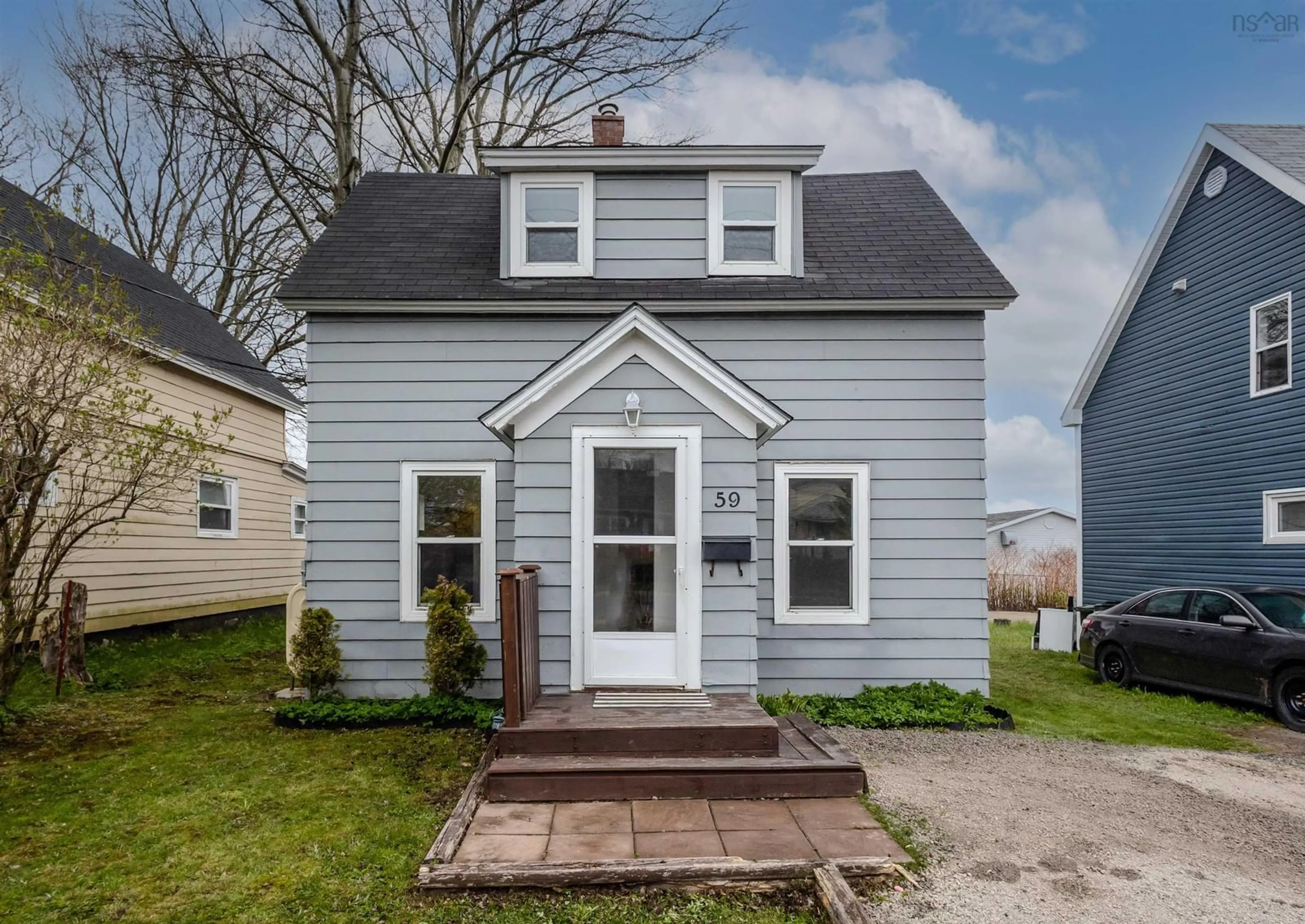Home with vinyl exterior material, street for 59 Davenport Rd, Sydney Nova Scotia B1P 5L5