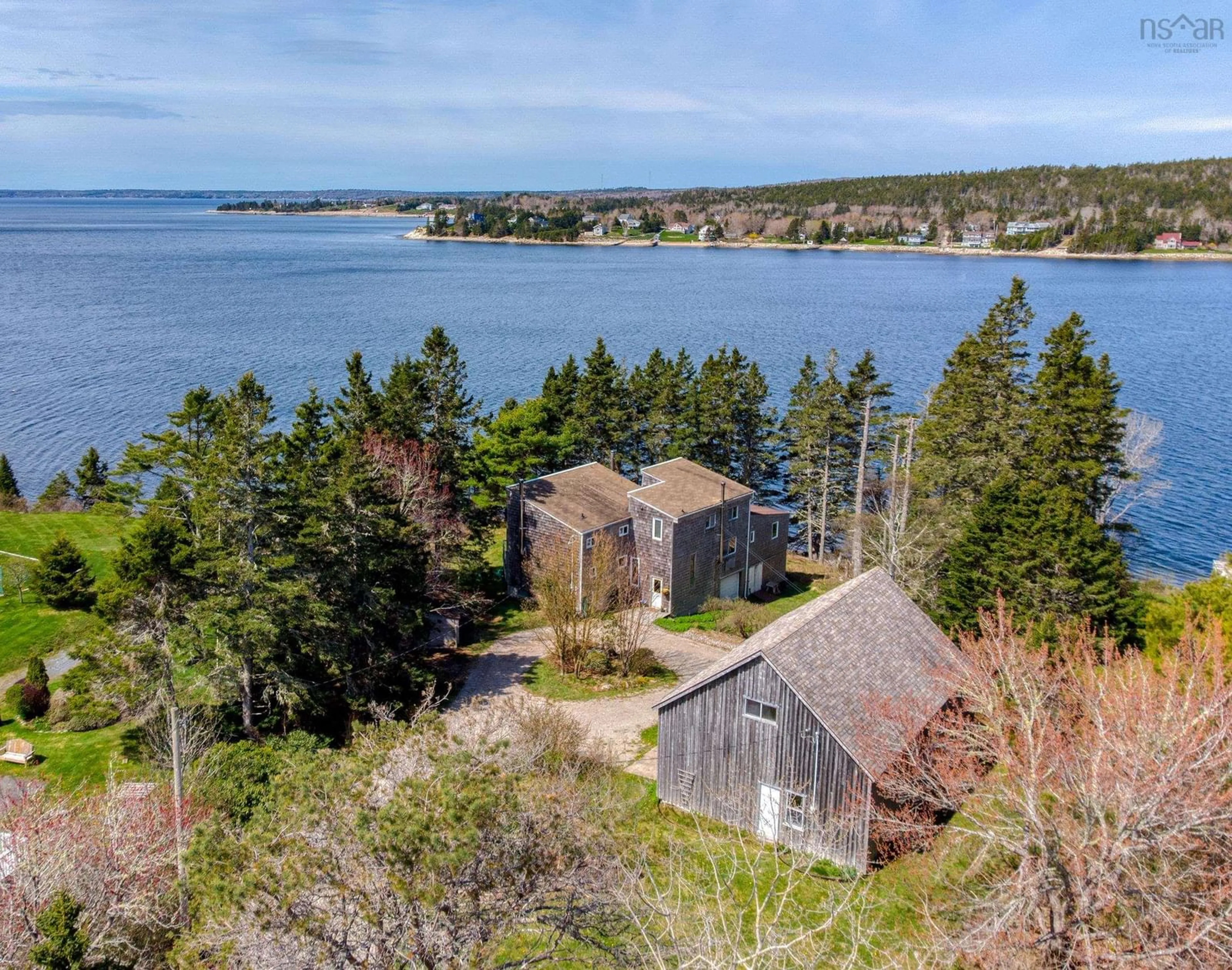 A pic from outside/outdoor area/front of a property/back of a property/a pic from drone, water/lake/river/ocean view for 19 Stevens Rd, Boutiliers Point Nova Scotia B3Z 1T4