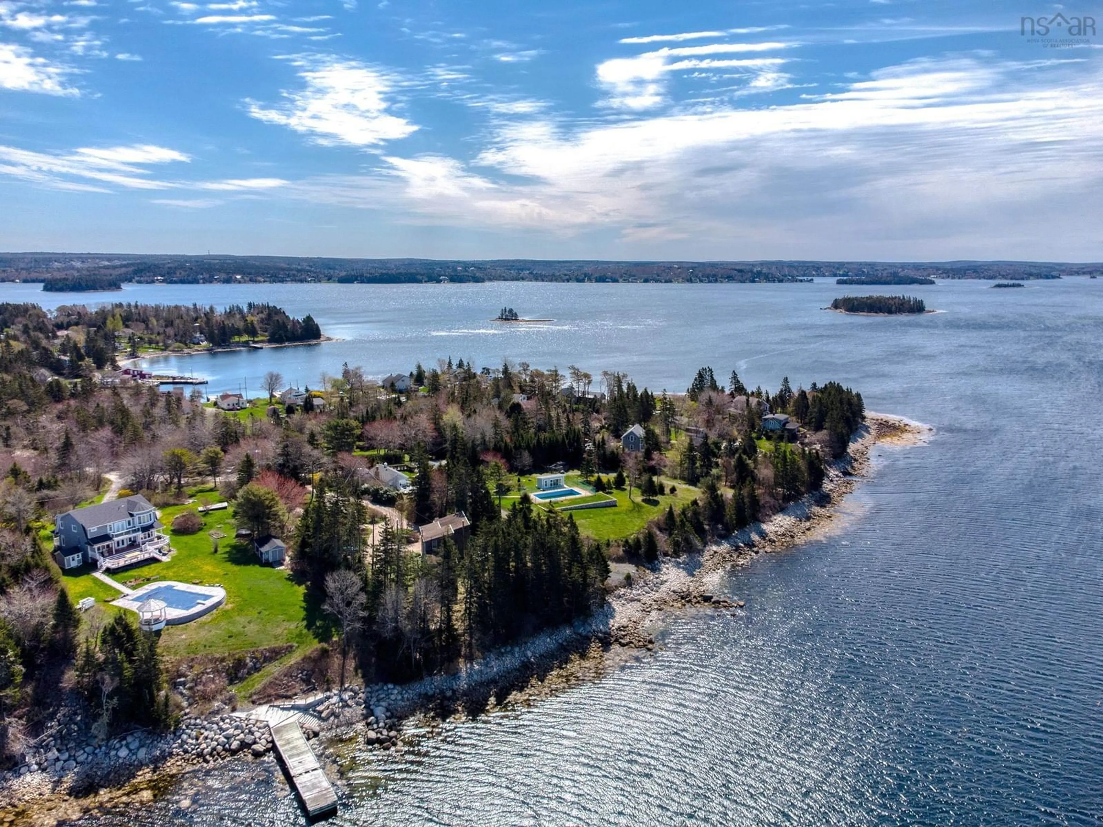A pic from outside/outdoor area/front of a property/back of a property/a pic from drone, water/lake/river/ocean view for 19 Stevens Rd, Boutiliers Point Nova Scotia B3Z 1T4