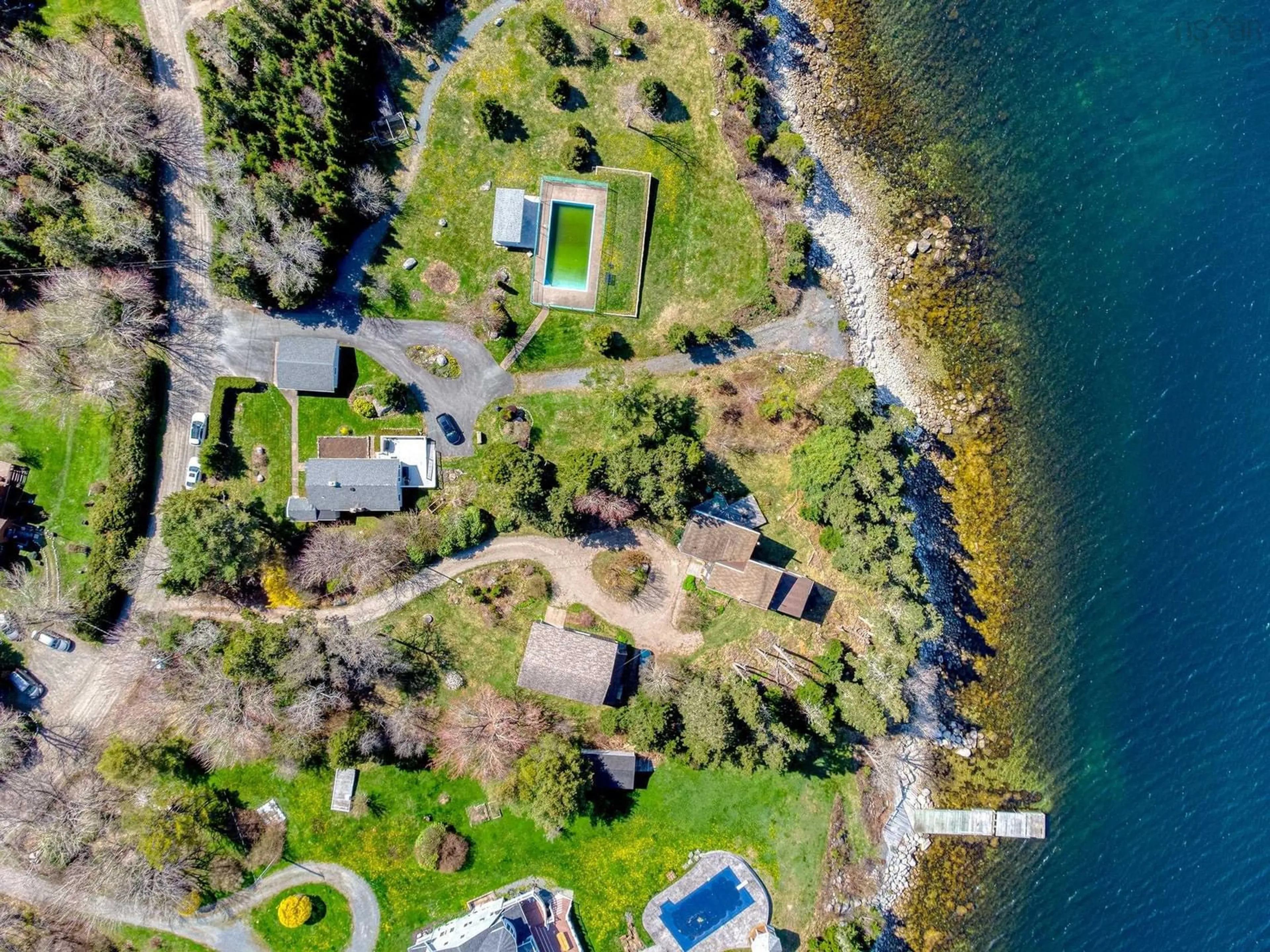 A pic from outside/outdoor area/front of a property/back of a property/a pic from drone, water/lake/river/ocean view for 19 Stevens Rd, Boutiliers Point Nova Scotia B3Z 1T4