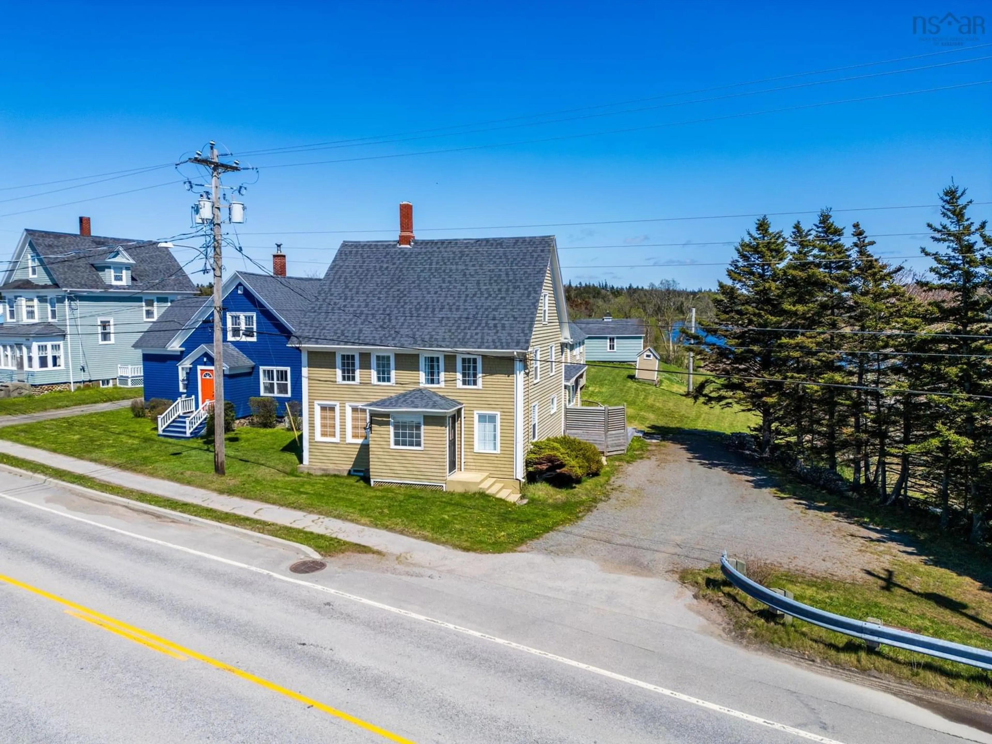 A pic from outside/outdoor area/front of a property/back of a property/a pic from drone, street for 9080 Highway 1, Meteghan River Nova Scotia B0W 2L0