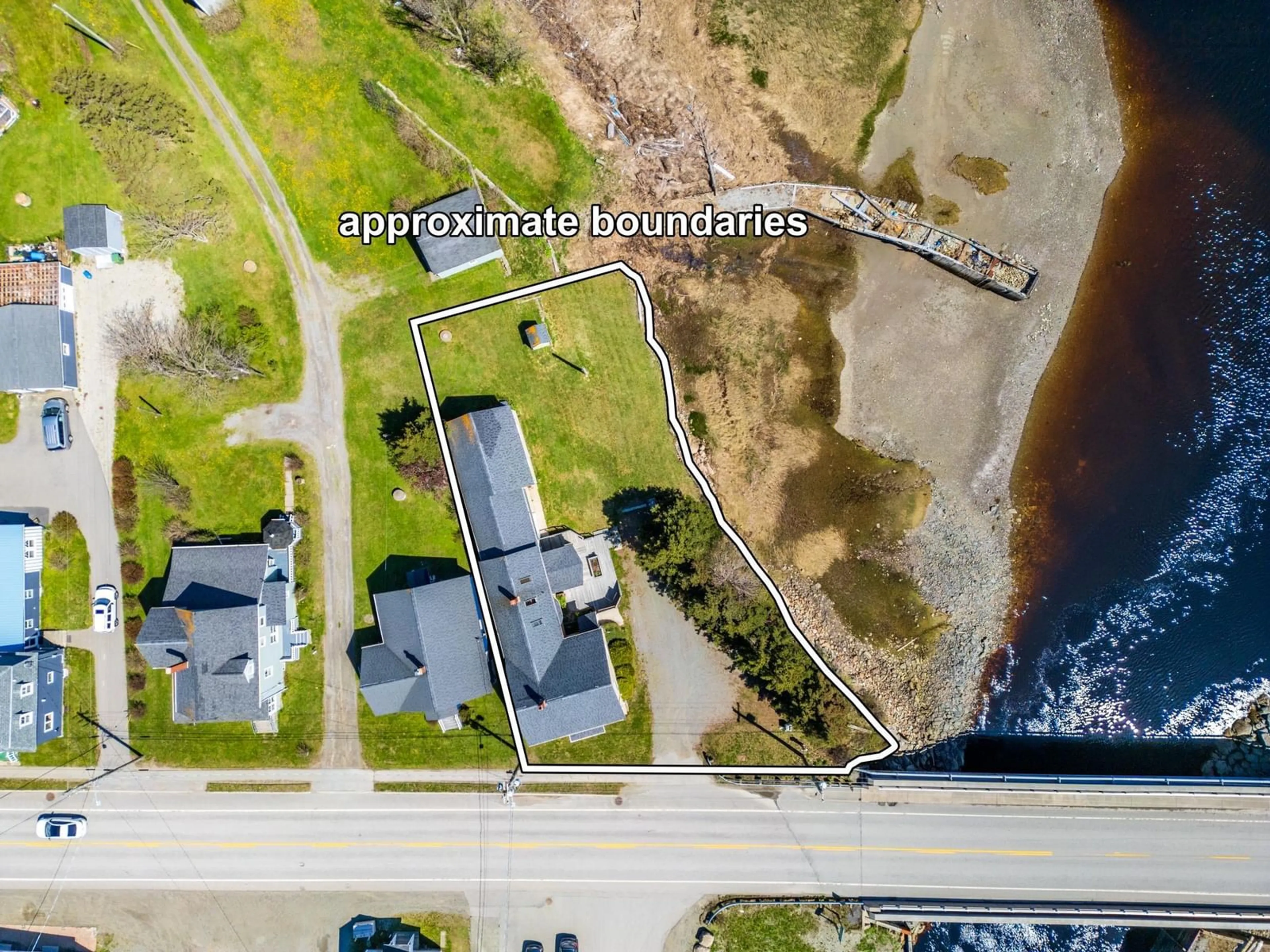 A pic from outside/outdoor area/front of a property/back of a property/a pic from drone, water/lake/river/ocean view for 9080 Highway 1, Meteghan River Nova Scotia B0W 2L0