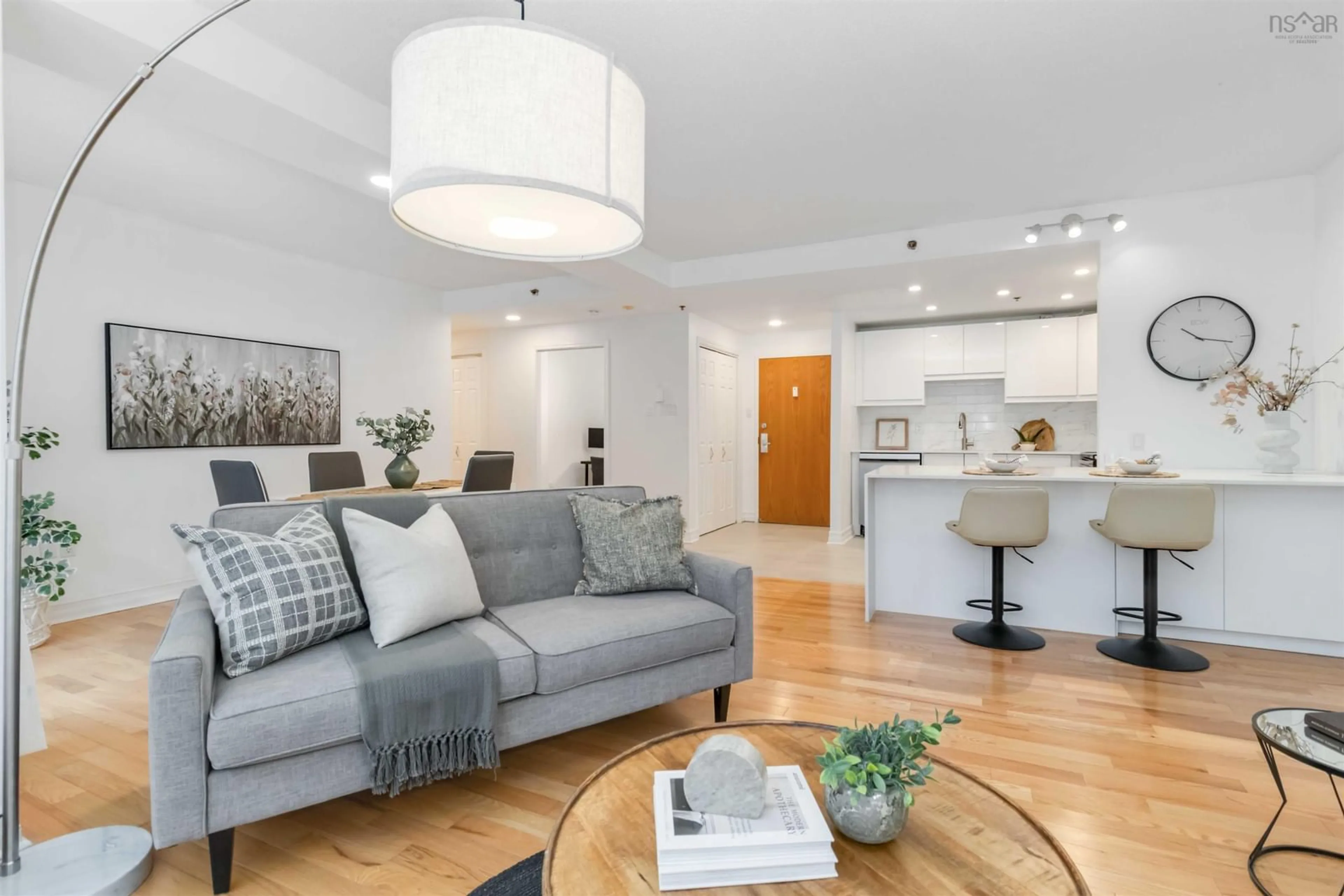 Living room with furniture, wood/laminate floor for 1350 Oxford Crt #101, Halifax Nova Scotia B3H 3Y8