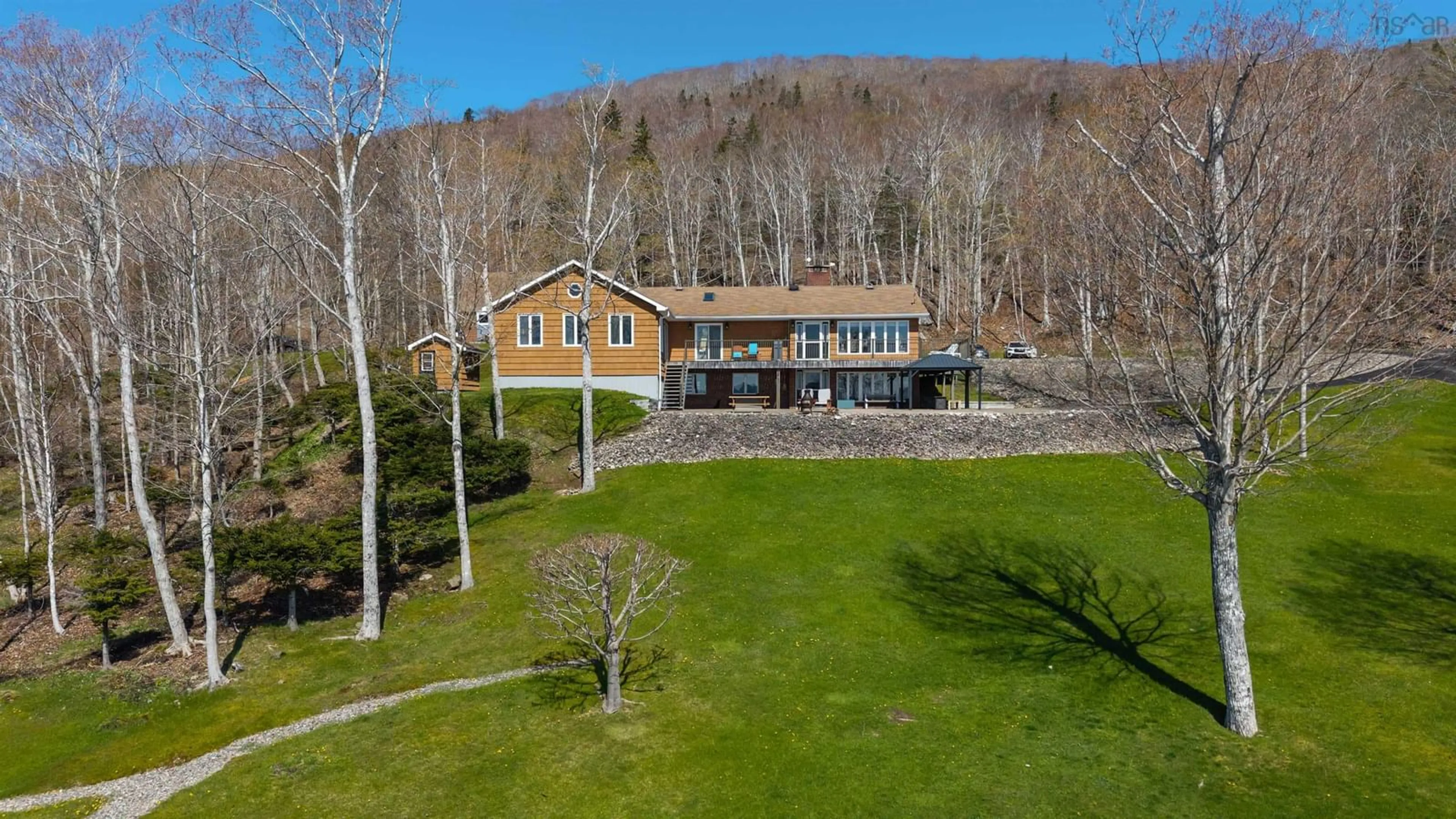 A pic from outside/outdoor area/front of a property/back of a property/a pic from drone, unknown for 3940 Marble Mountain Rd, Lime Hill Nova Scotia B0E 2Y0