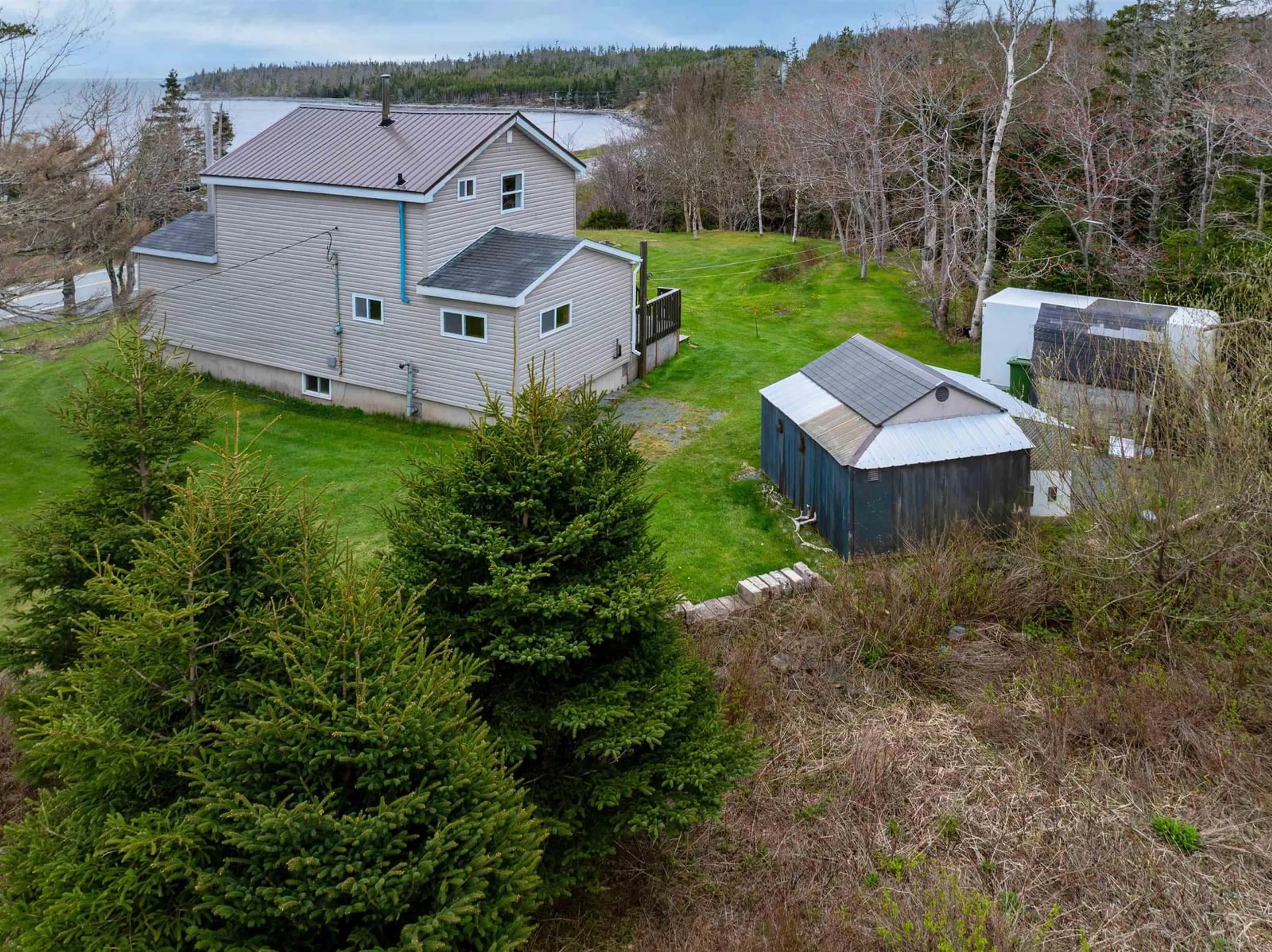 A pic from outside/outdoor area/front of a property/back of a property/a pic from drone, water/lake/river/ocean view for 28111 Highway, Moosehead Nova Scotia B0J 2K0