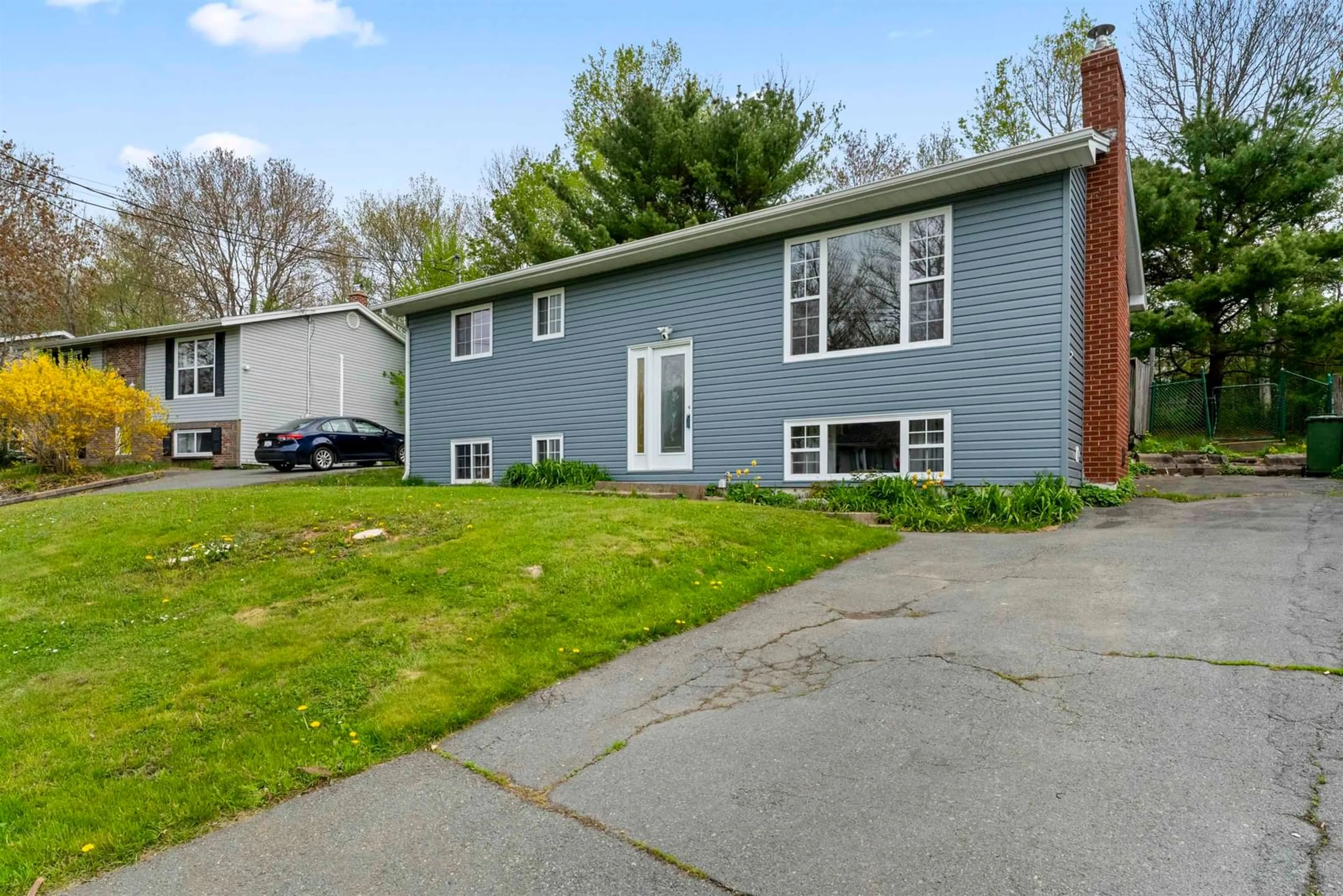 Home with vinyl exterior material, street for 1558 Riverside Dr, Lower Sackville Nova Scotia B4C 2Y7