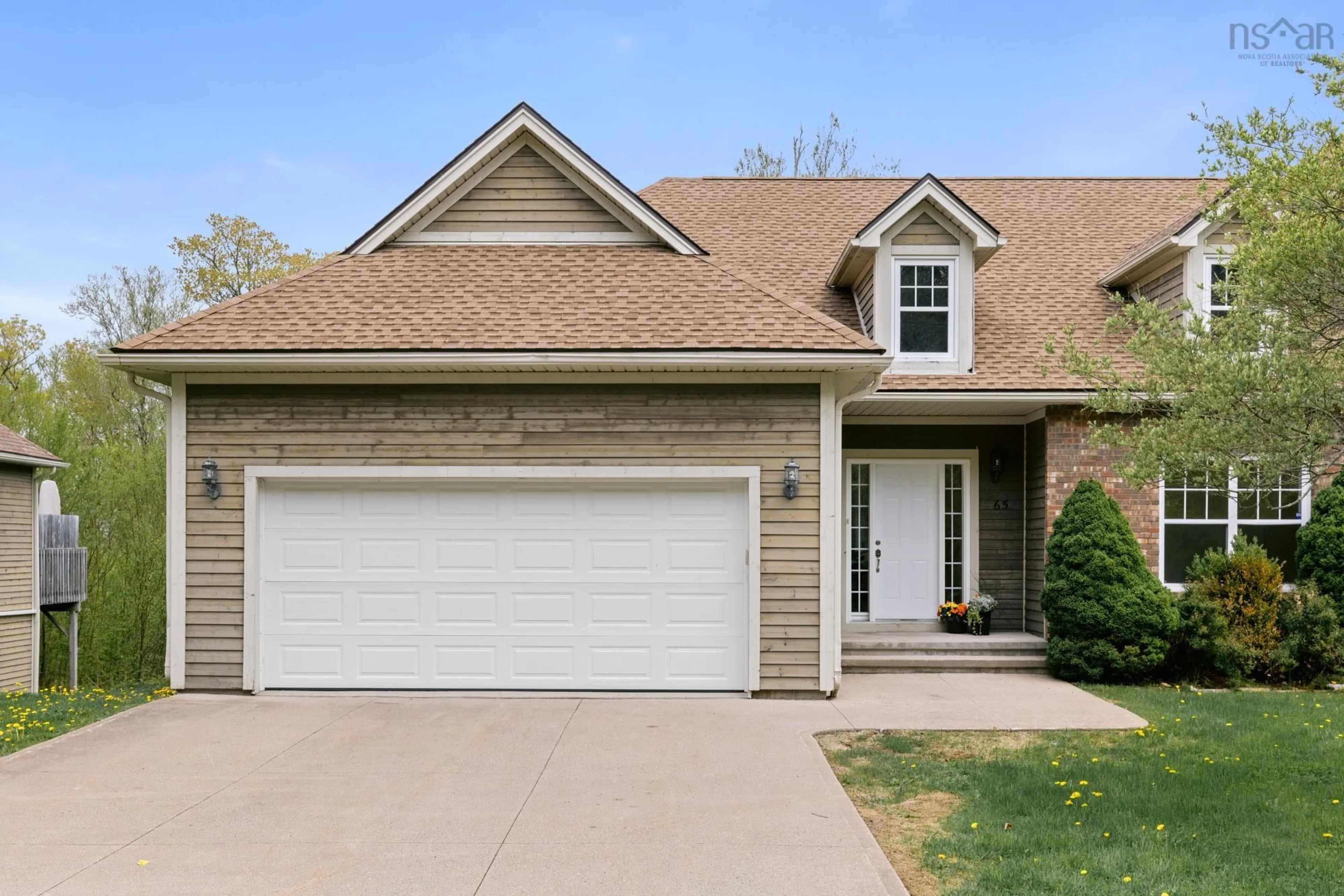 Home with brick exterior material, street for 65 Carnoustie Dr, Hammonds Plains Nova Scotia B4B 0E5