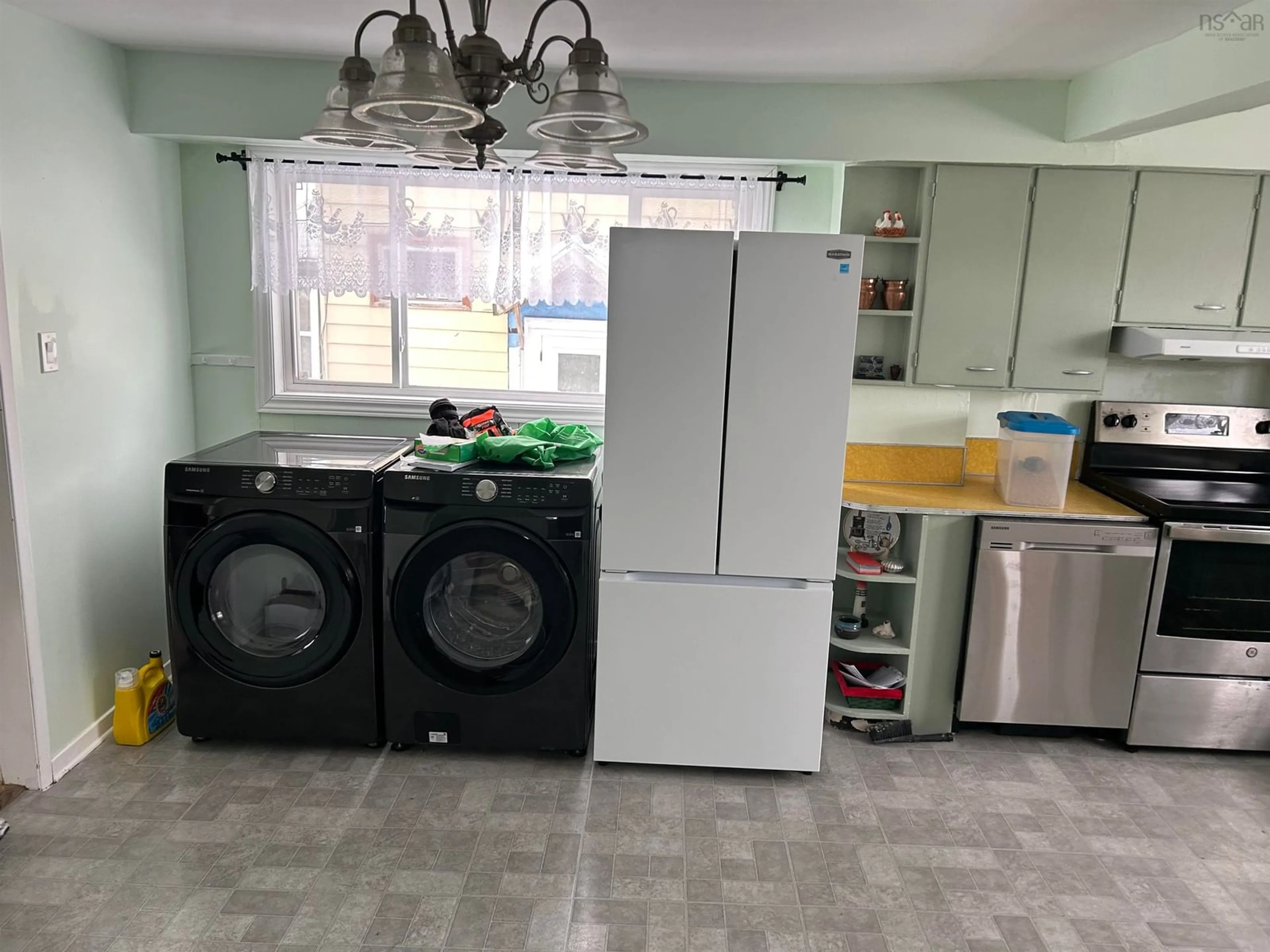 Kitchen with laundary machines, unknown for 45 Ashby Rd, Sydney Nova Scotia B1P 2R7