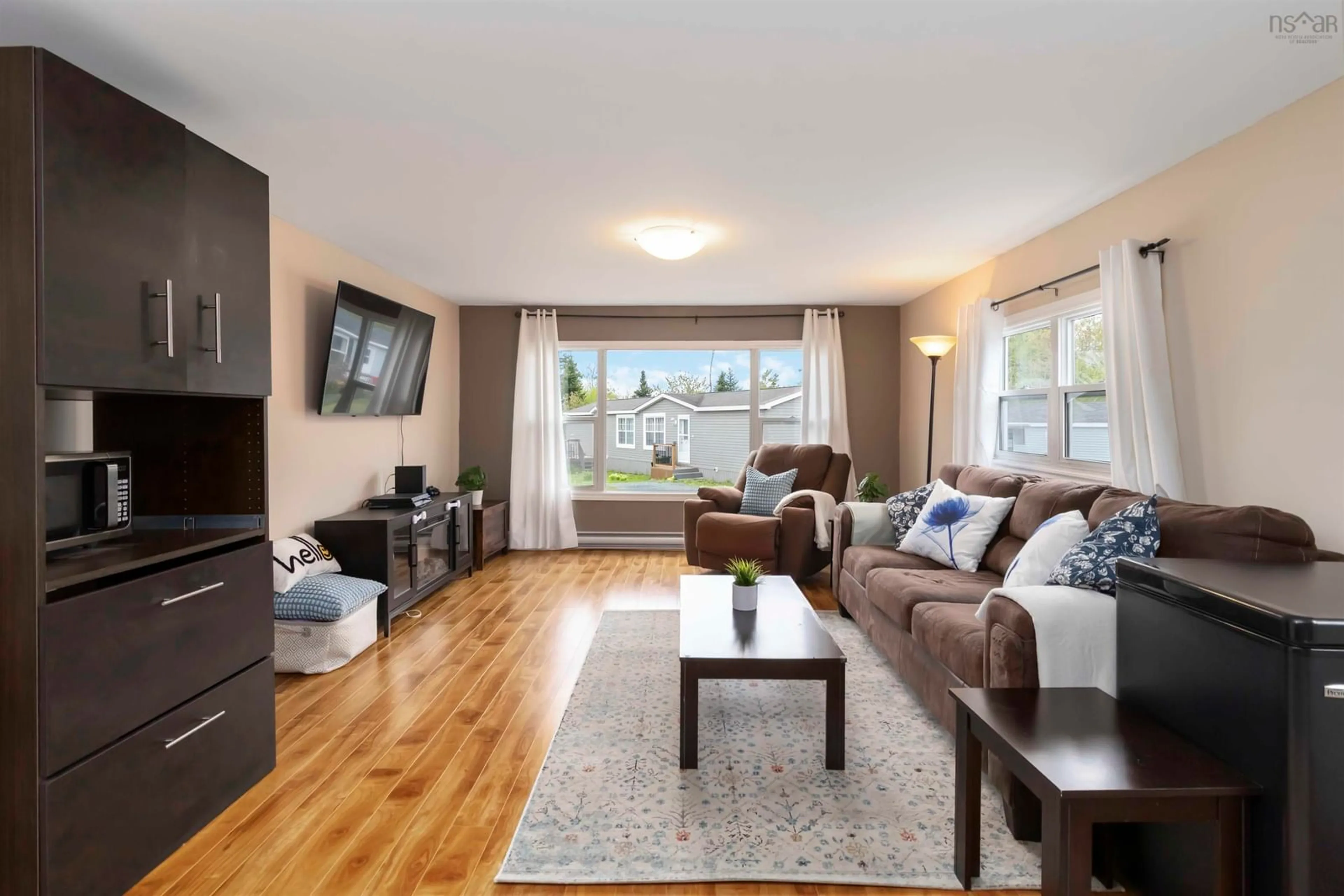 Living room with furniture, wood/laminate floor for 18 Happy Dr, Lake Echo Nova Scotia B3E 1C4