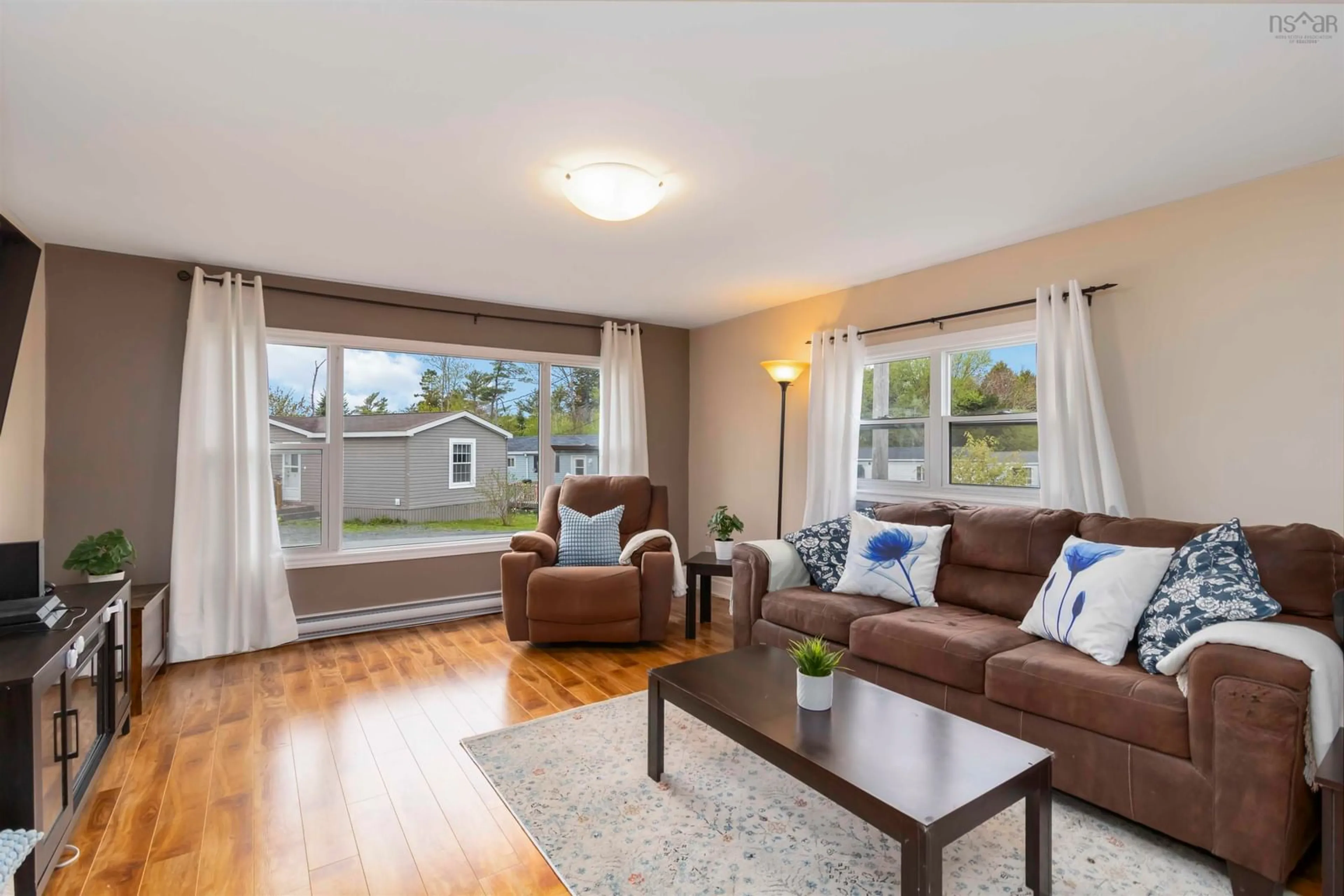 Living room with furniture, wood/laminate floor for 18 Happy Dr, Lake Echo Nova Scotia B3E 1C4