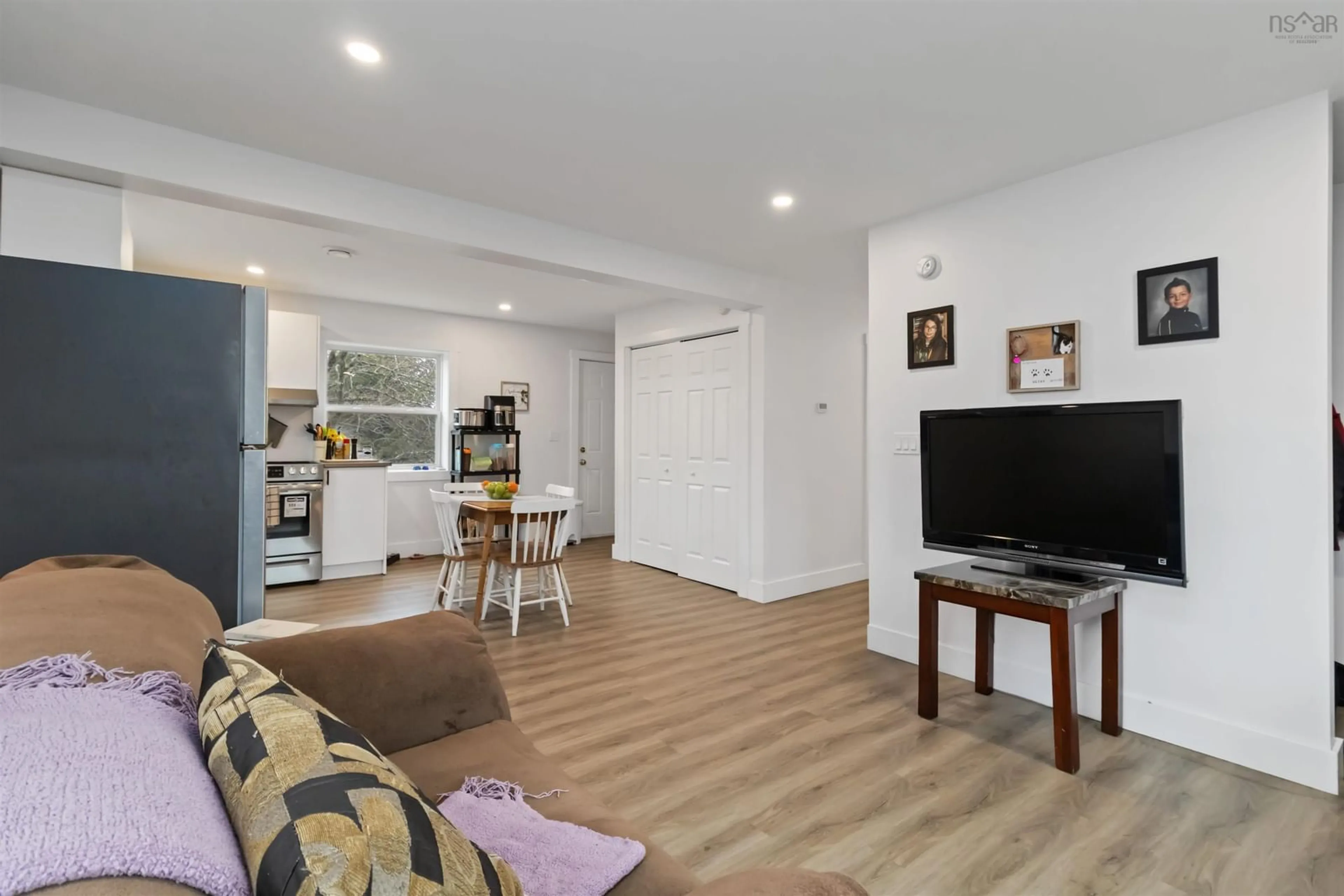 Living room with furniture, wood/laminate floor for 80/82 First St, Middle Sackville Nova Scotia B4E 1T1