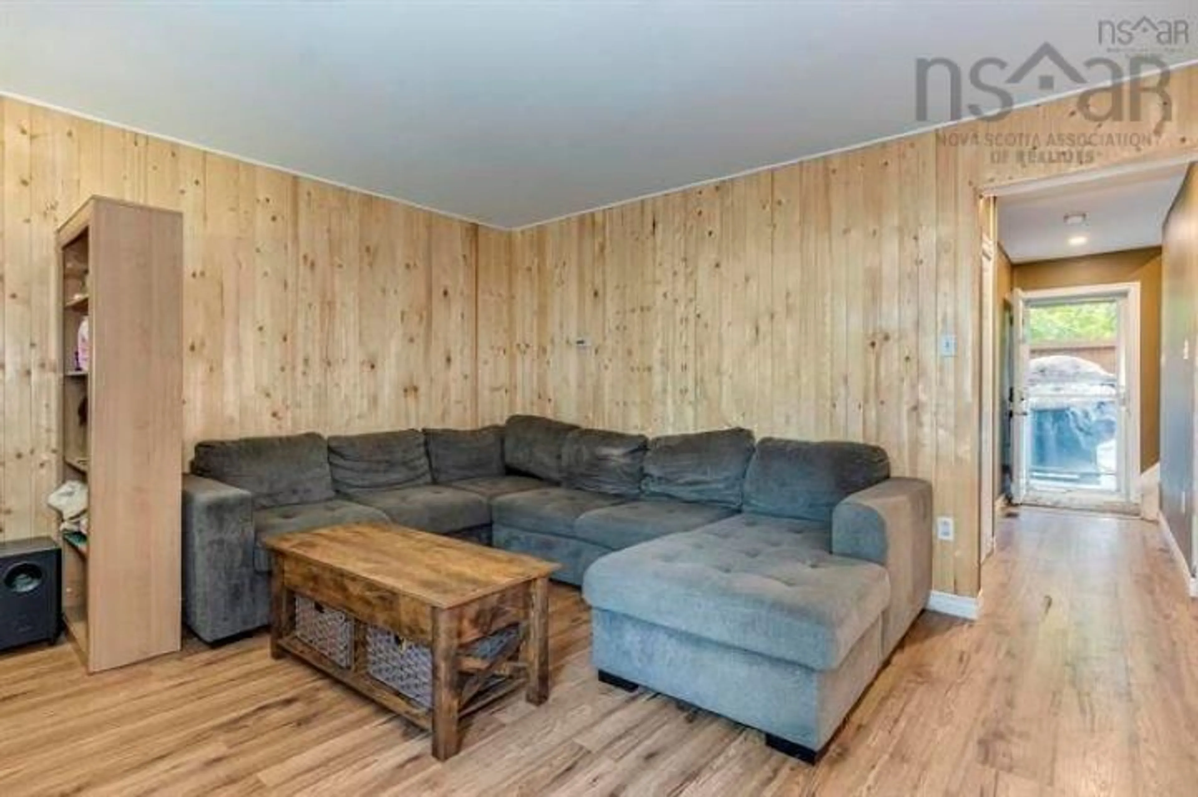Living room with furniture, wood/laminate floor for 56 Spar Cres, Dartmouth Nova Scotia B2W 4A2