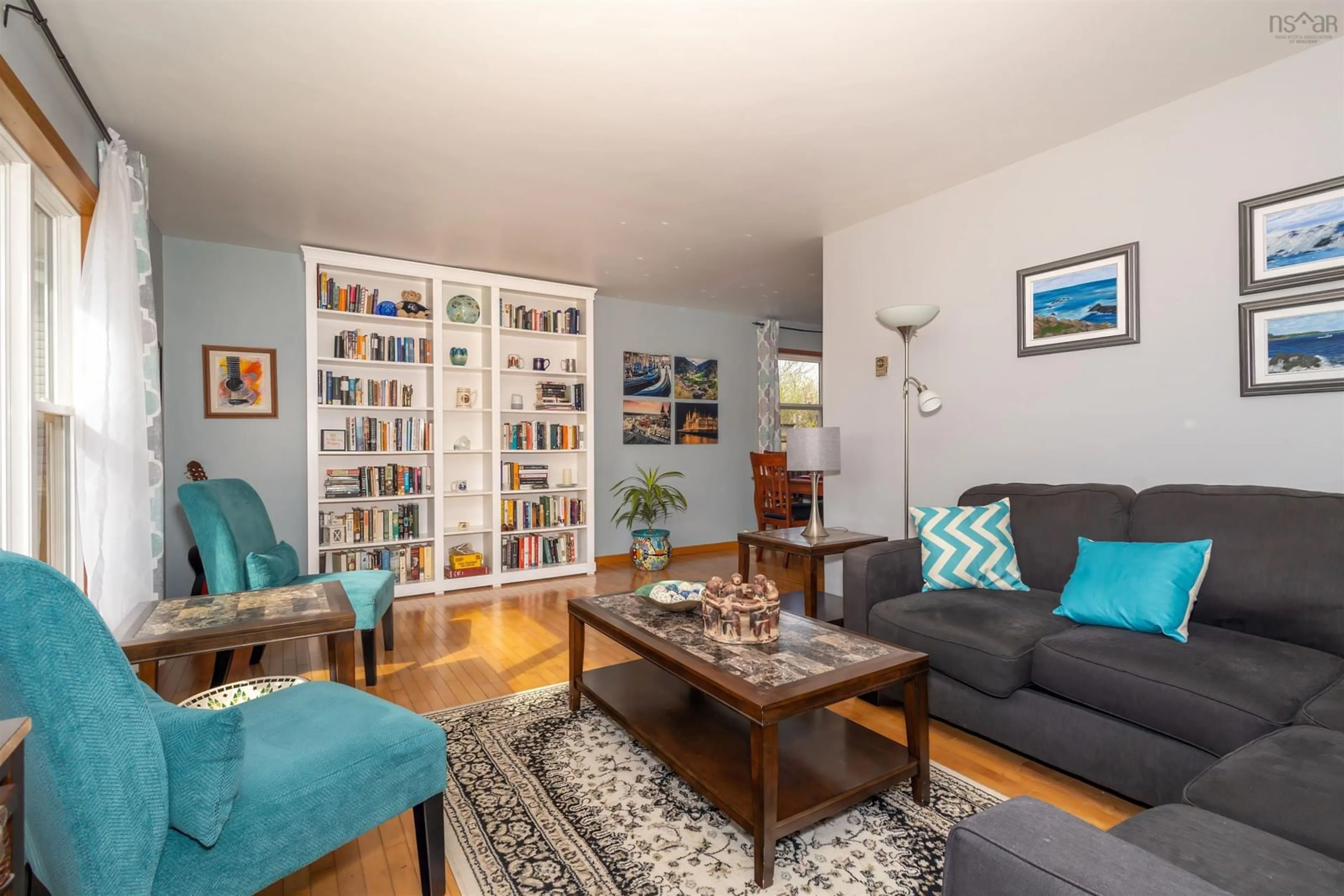 Living room with furniture, wood/laminate floor for 18 Cedar Crt, Sydney Nova Scotia B1P 6S1