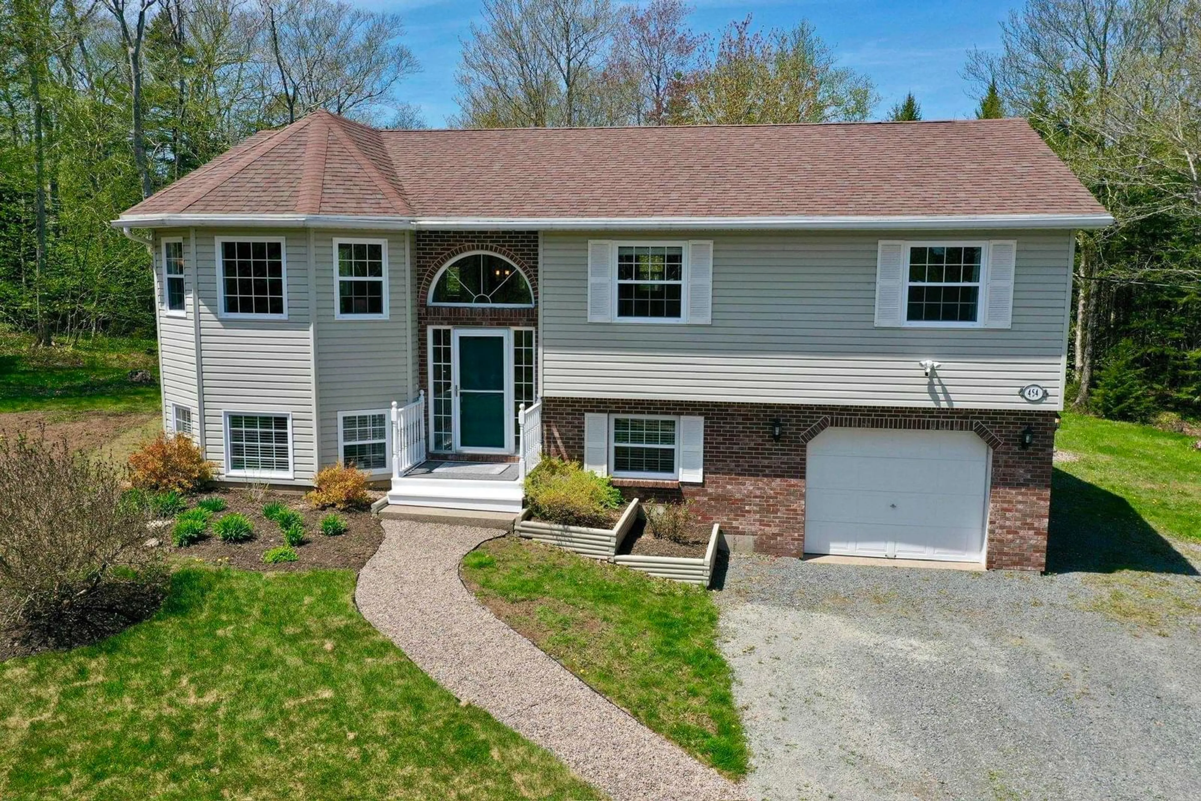 A pic from outside/outdoor area/front of a property/back of a property/a pic from drone, street for 454 Tattenham Cres, Hammonds Plains Nova Scotia B4B 1V3